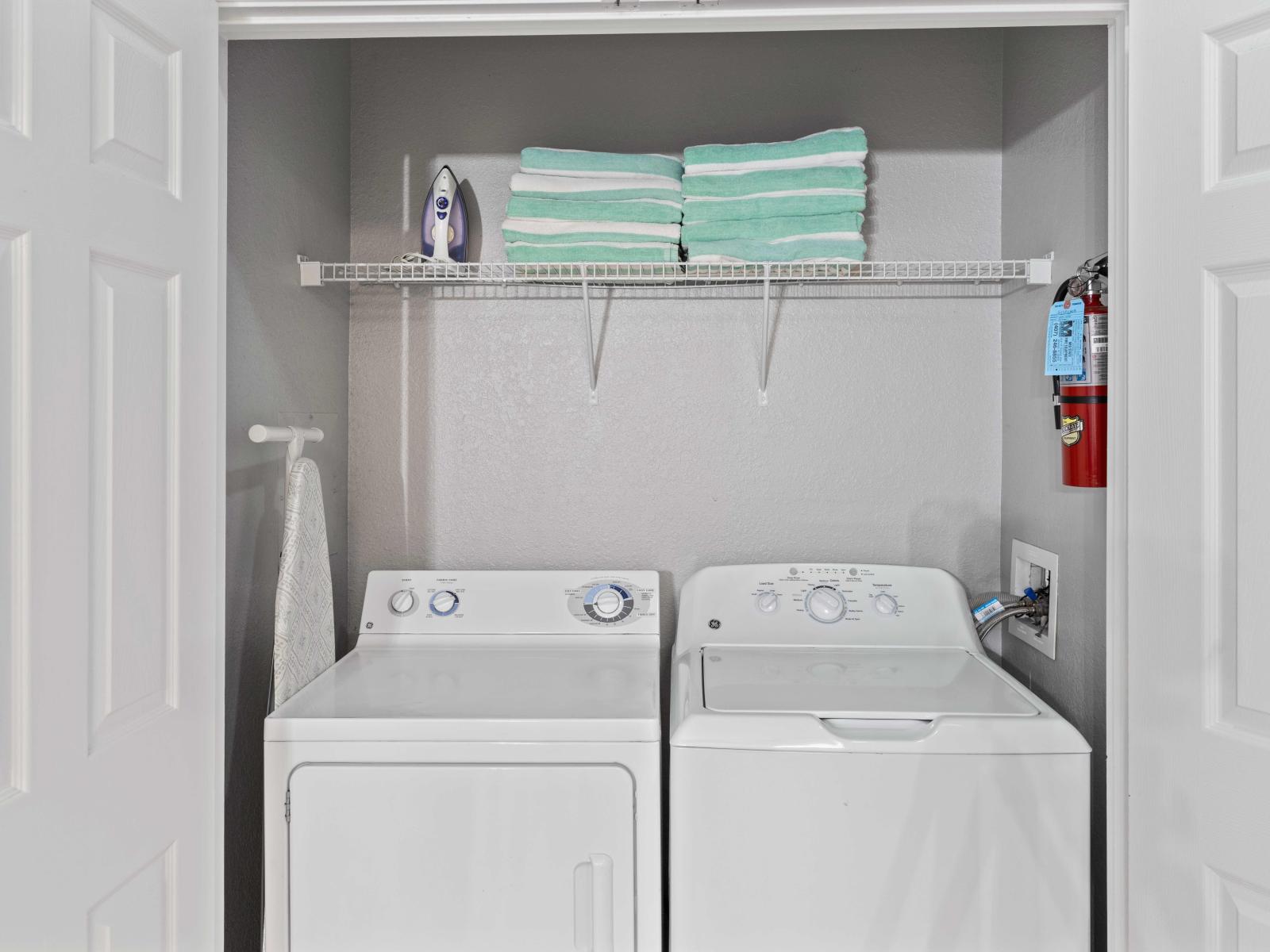 Laundry Area of the condo in Orlando - The washer and dryer provides  the convenience of being able to freshen up  - A hassle-free and comfortable experience amidst the resort's amenities