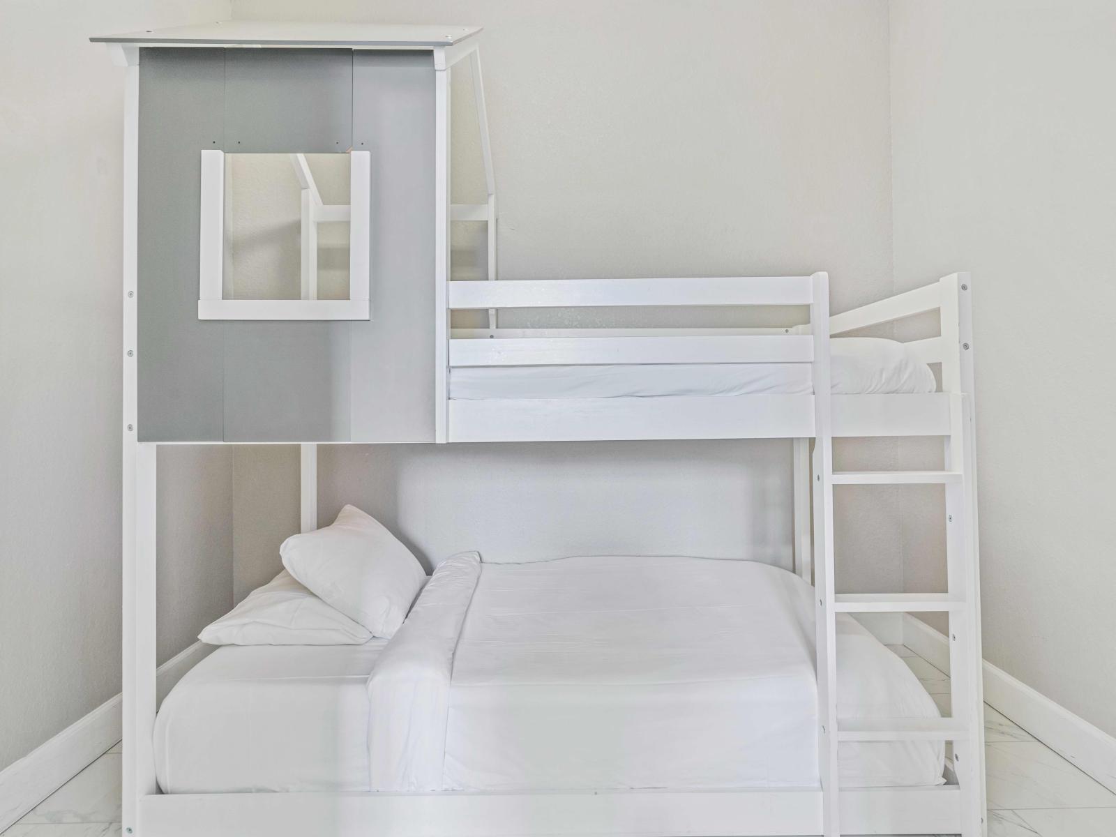 The large closet in bedroom 3 contains a bunk bed with 2 additional single beds, perfect for kids.
