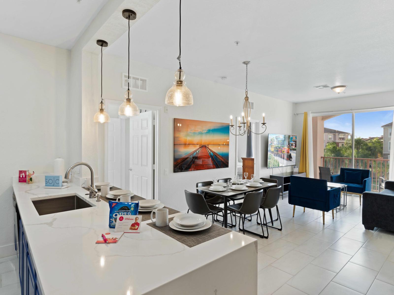 Experience the joy of cooking in our fully equipped kitchen, seamlessly connected to the open dining area, creating the perfect space for shared meals and lasting memories.