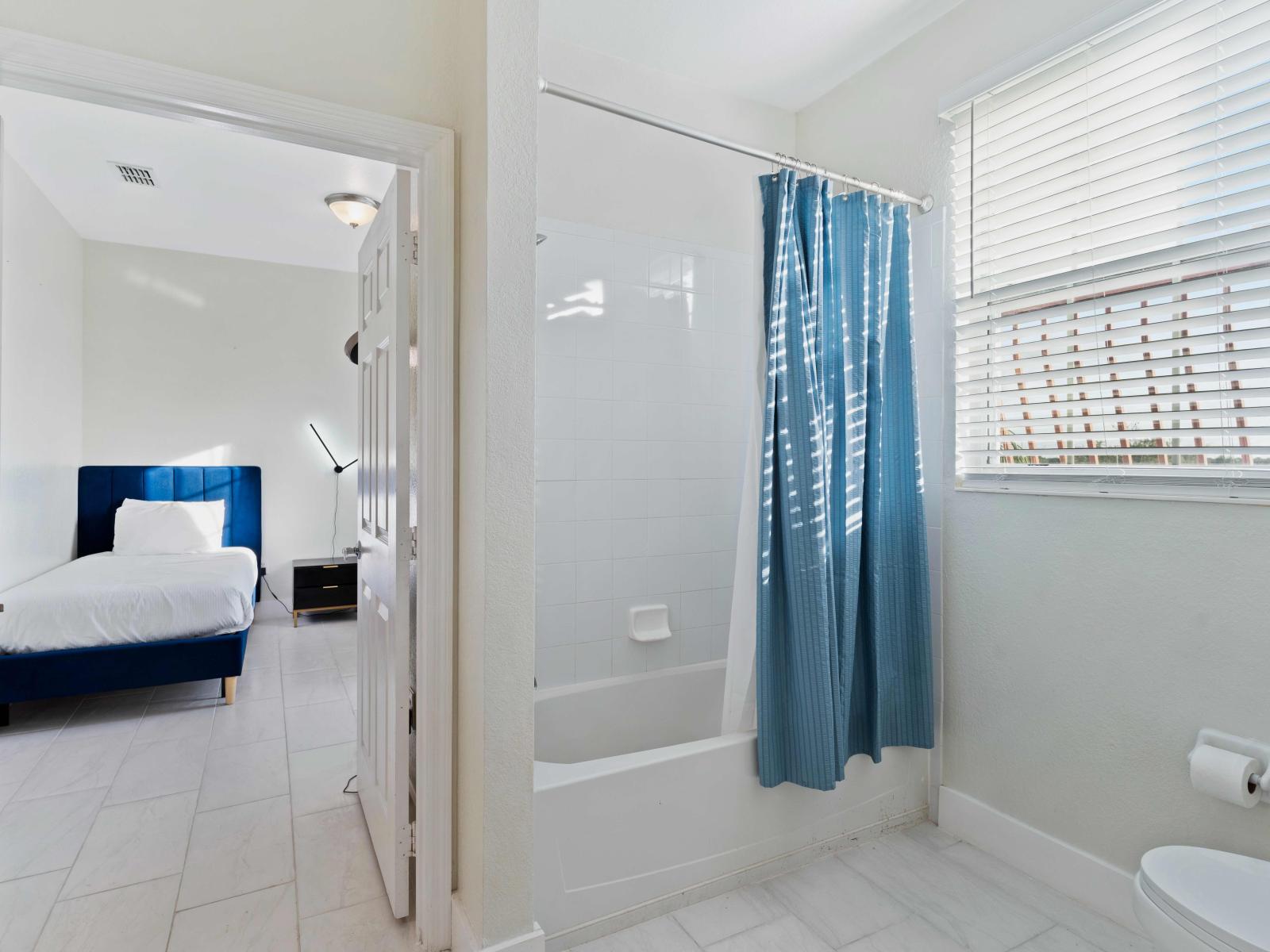 Enjoy the convenience of the Jack and Jill bathroom, accessible from both Bedroom 2 and Bedroom 3, offering shared amenities for added comfort and ease of use.