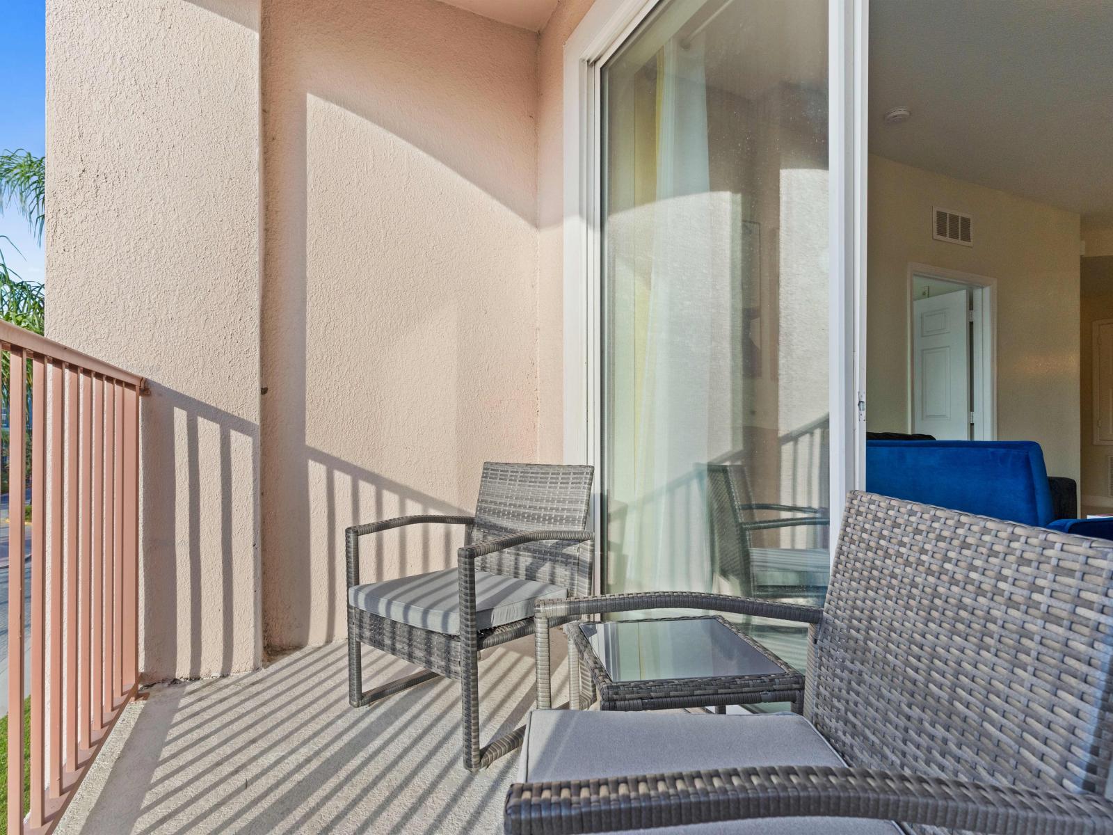 Experience the charming ambiance of your private balcony of the condo in Orlando - Complete with cozy furnishings - Enjoy intimate moments with your loved ones - Perfect for relaxation and soaking up the sunshine.