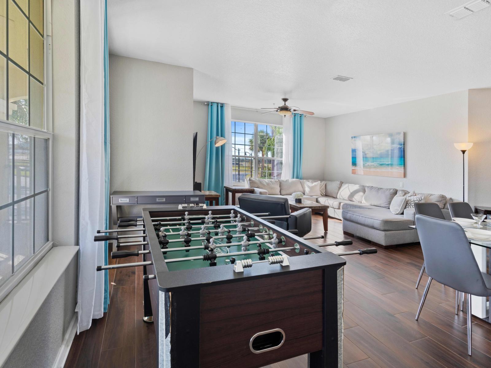 Enjoy endless entertainment in the living room with our Foosball table. Gather with friends and family for lively matches and create unforgettable memories in this vibrant space.