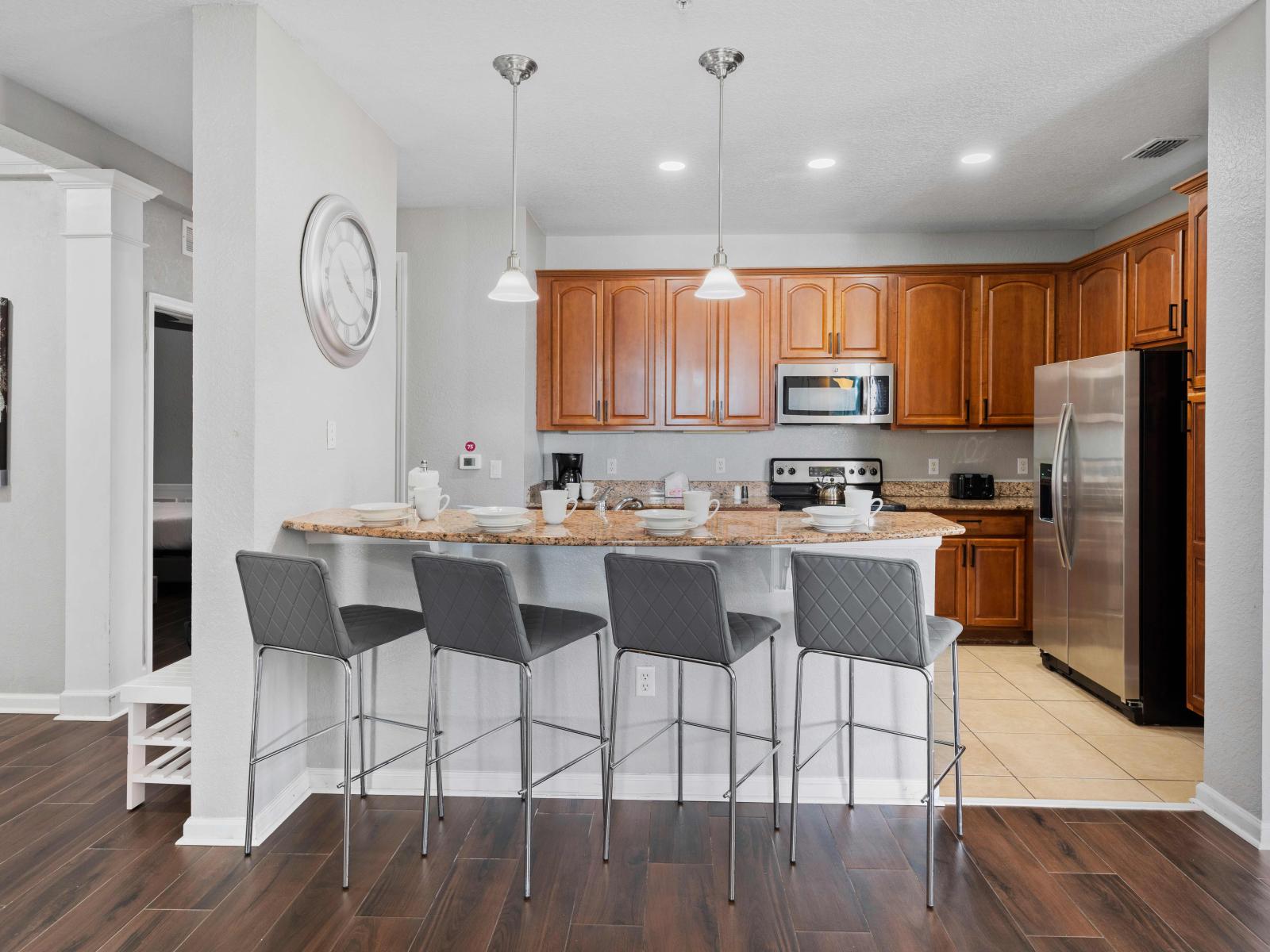 The breakfast bar offers a cozy spot for casual dining or enjoying a quick bite, making it the heart of the home.