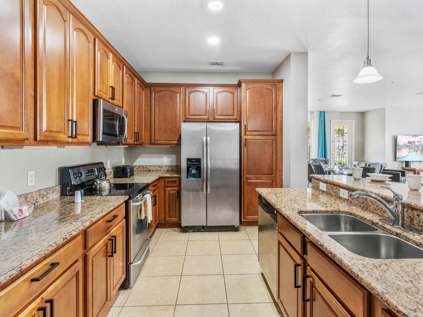 Start your day right in our fully equipped kitchen featuring a convenient breakfast bar. From morning coffee to hearty breakfasts, this space is designed for culinary delights and shared moments.