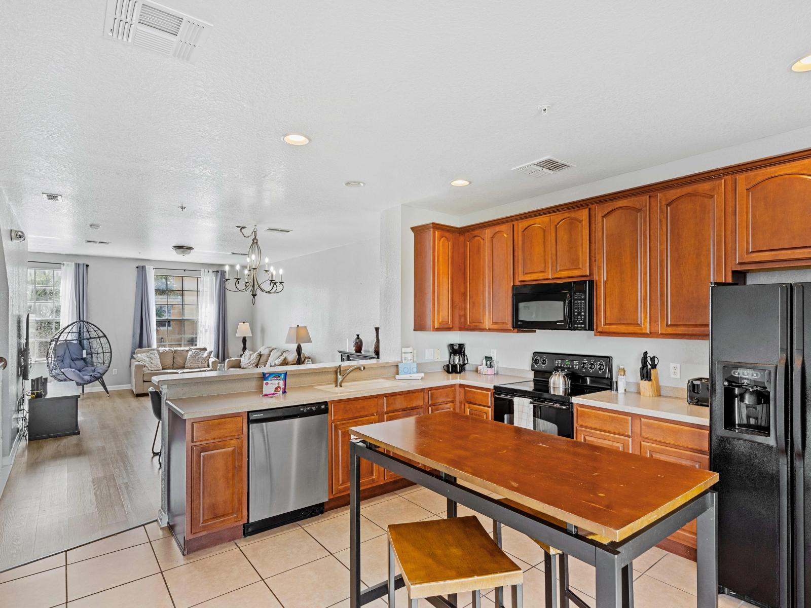 Boasting modern appliances, ample counter space, and a comprehensive array of cookware and utensils, this kitchen invites you to unleash your inner chef.