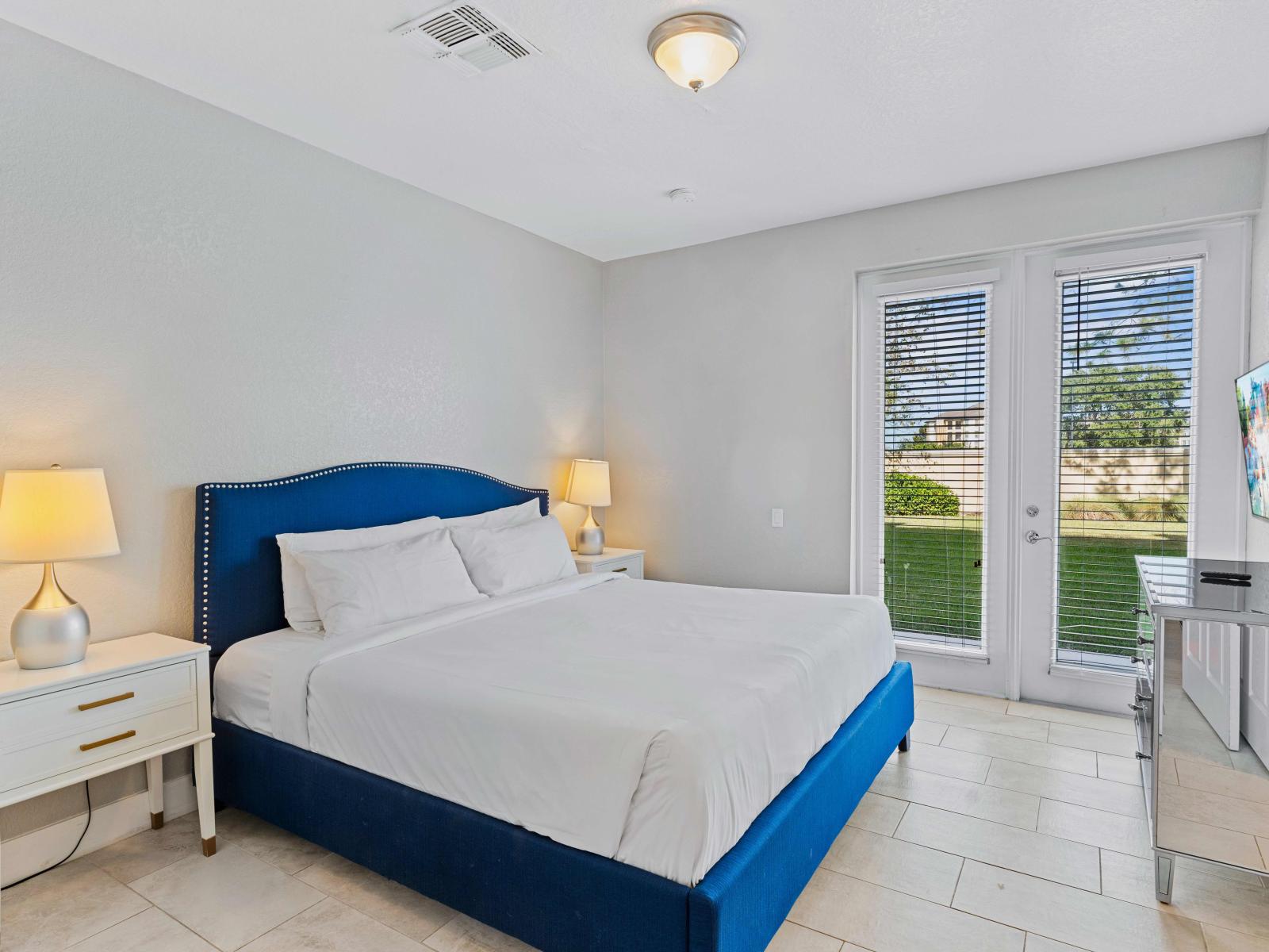 Luxury Bedroom of the Townhouse in Orlando - Adorned with Exquisite Furnishings  - Smart TV and Netflix - Access to outdoors with seating - Comfy double sized bed