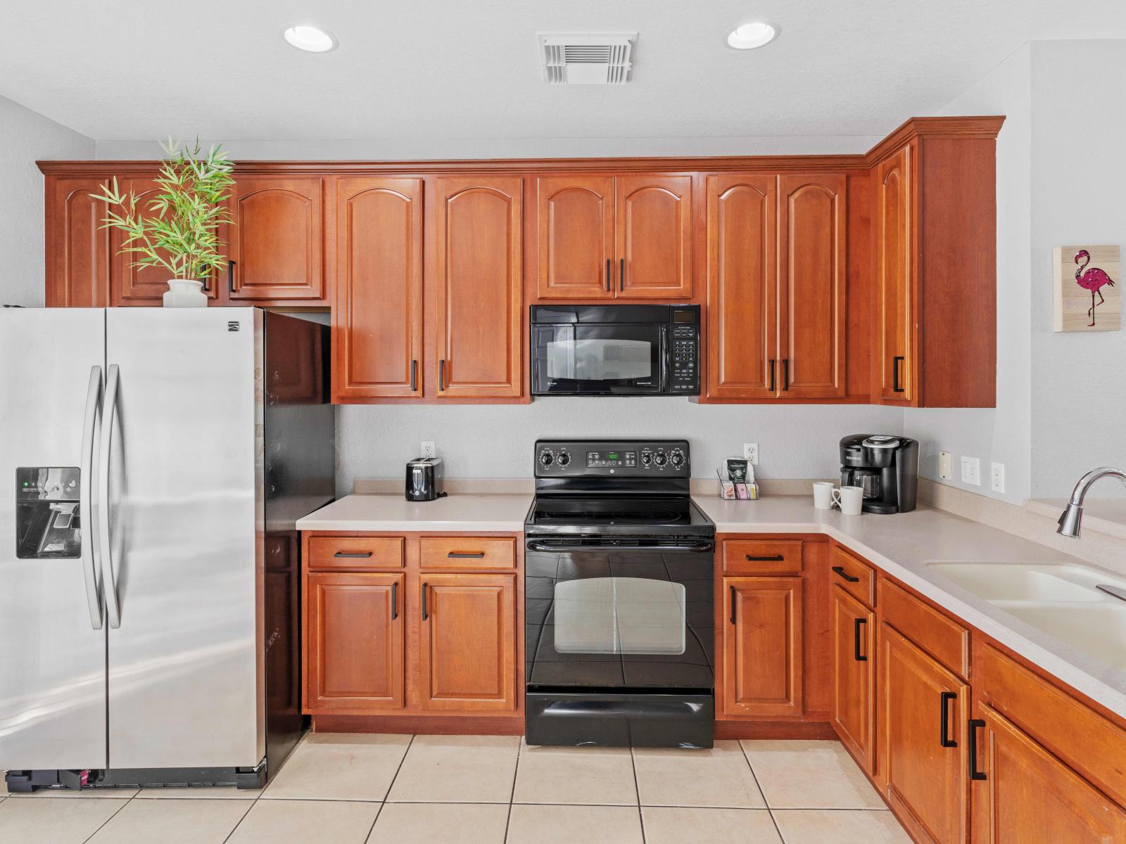 Our fully equipped kitchen boasts a sleek design and top-of-the-line appliances, perfect for whipping up delicious meals.