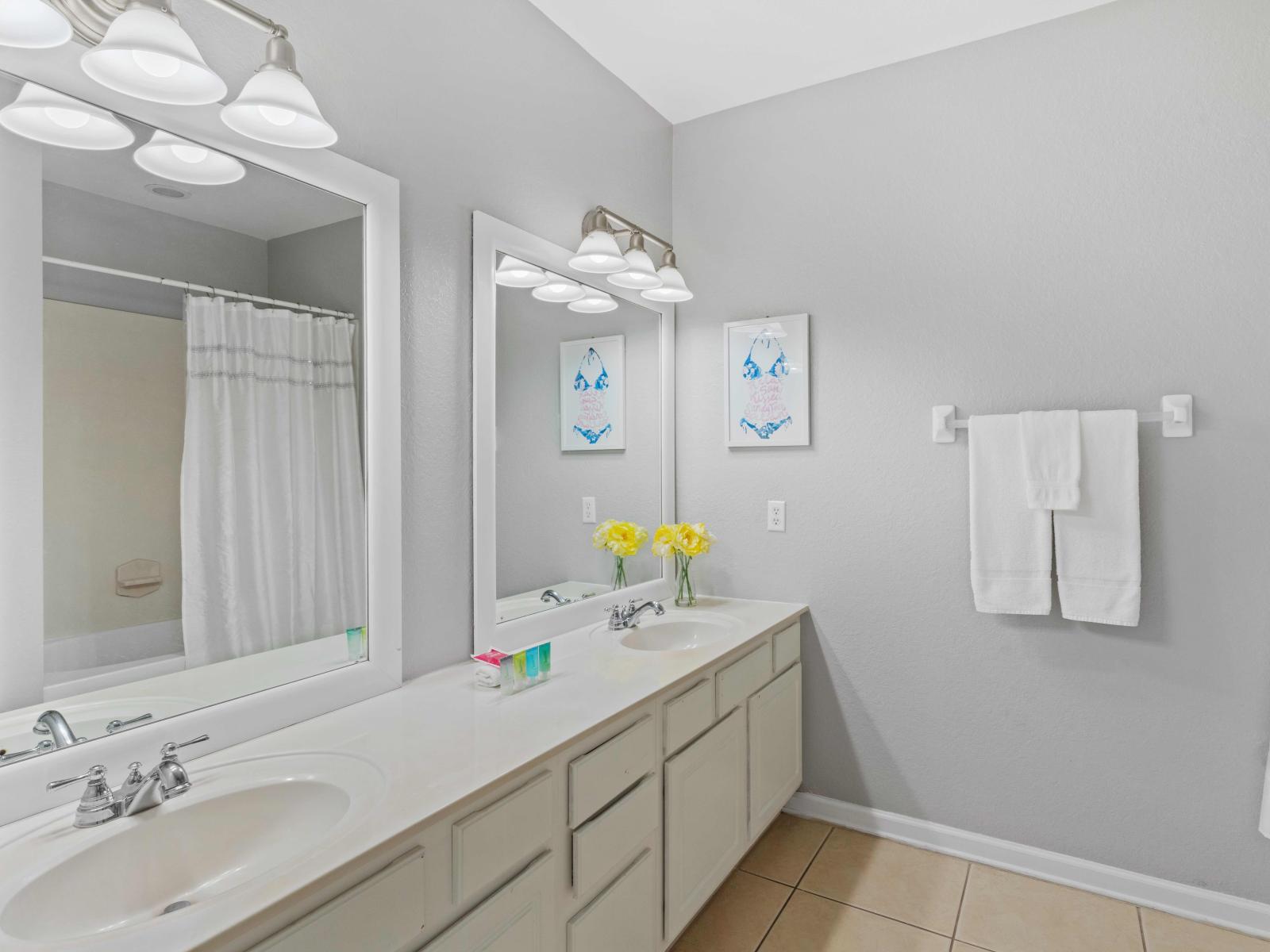 Bathroom 3 boasts a double sink vanity, providing ample space for guests to prepare for the day ahead. Featuring a convenient tub/shower combination, this bathroom offers both functionality and comfort for a refreshing bathing experience.