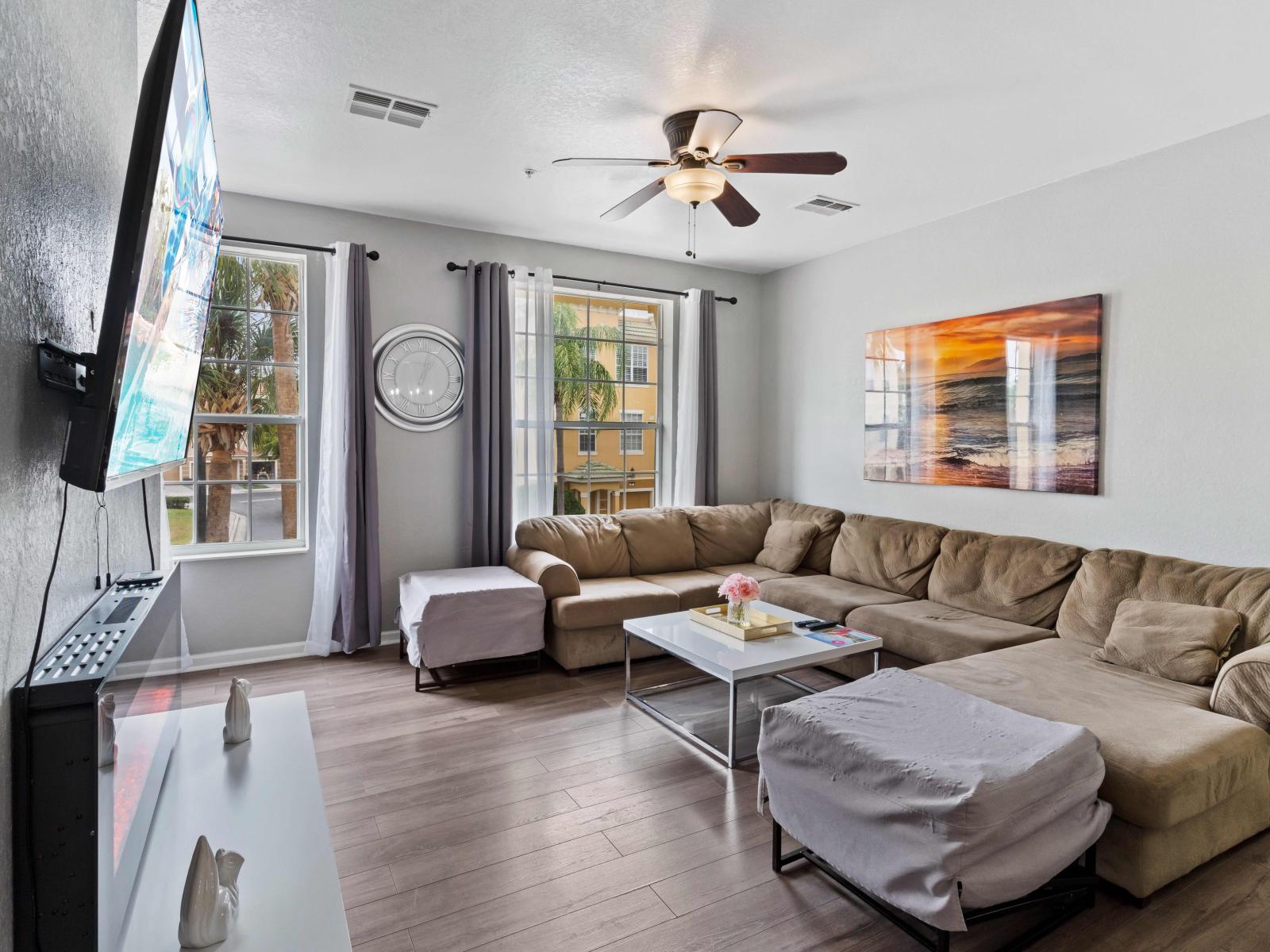 Spacious Living Area of the townhouse in Orlando Florida - Embrace comfort and warmth in cozy living area - Relaxation and serenity harmonize effortlessly - Well-chosen lighting fixtures - Availability of Tv and Netflix