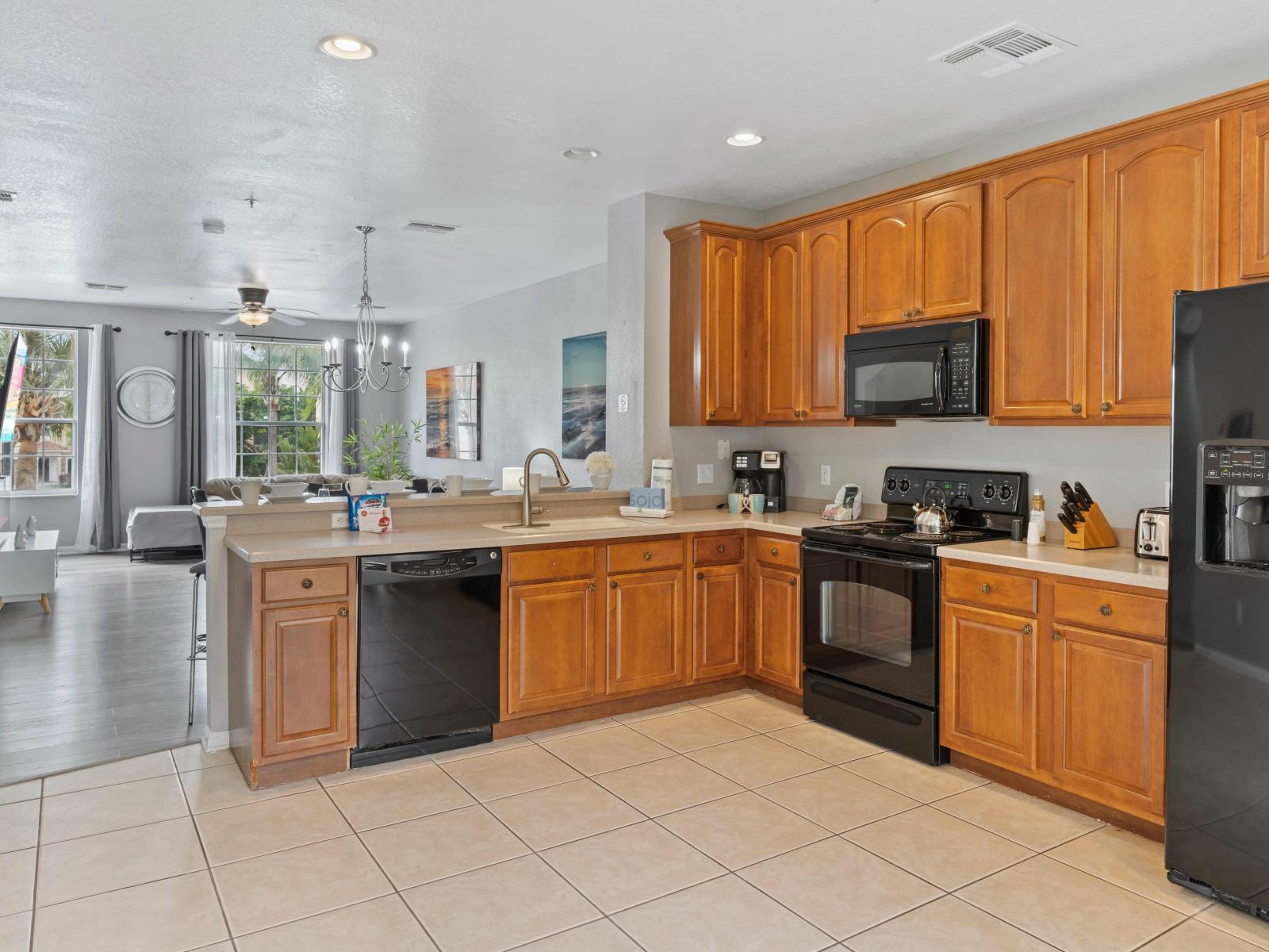 Sleek kitchen of the townhouse in Orlando Florida - Comes with beautiful granite counter tops and stainless steel appliances - Fully Equipped - High Chairs and Breakfast bar