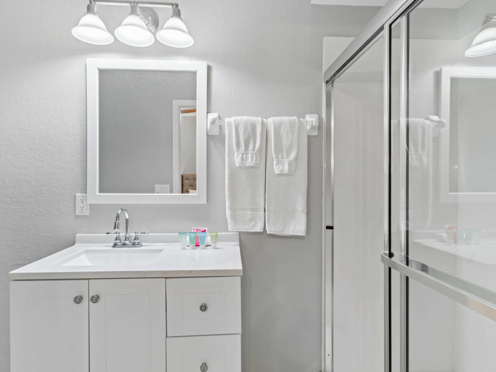 En-suite Bathroom 1 at Vista Cay Resort boasts a spacious walk-in shower, offering guests a luxurious and rejuvenating experience, where modern elegance meets ultimate comfort for a truly indulgent retreat.