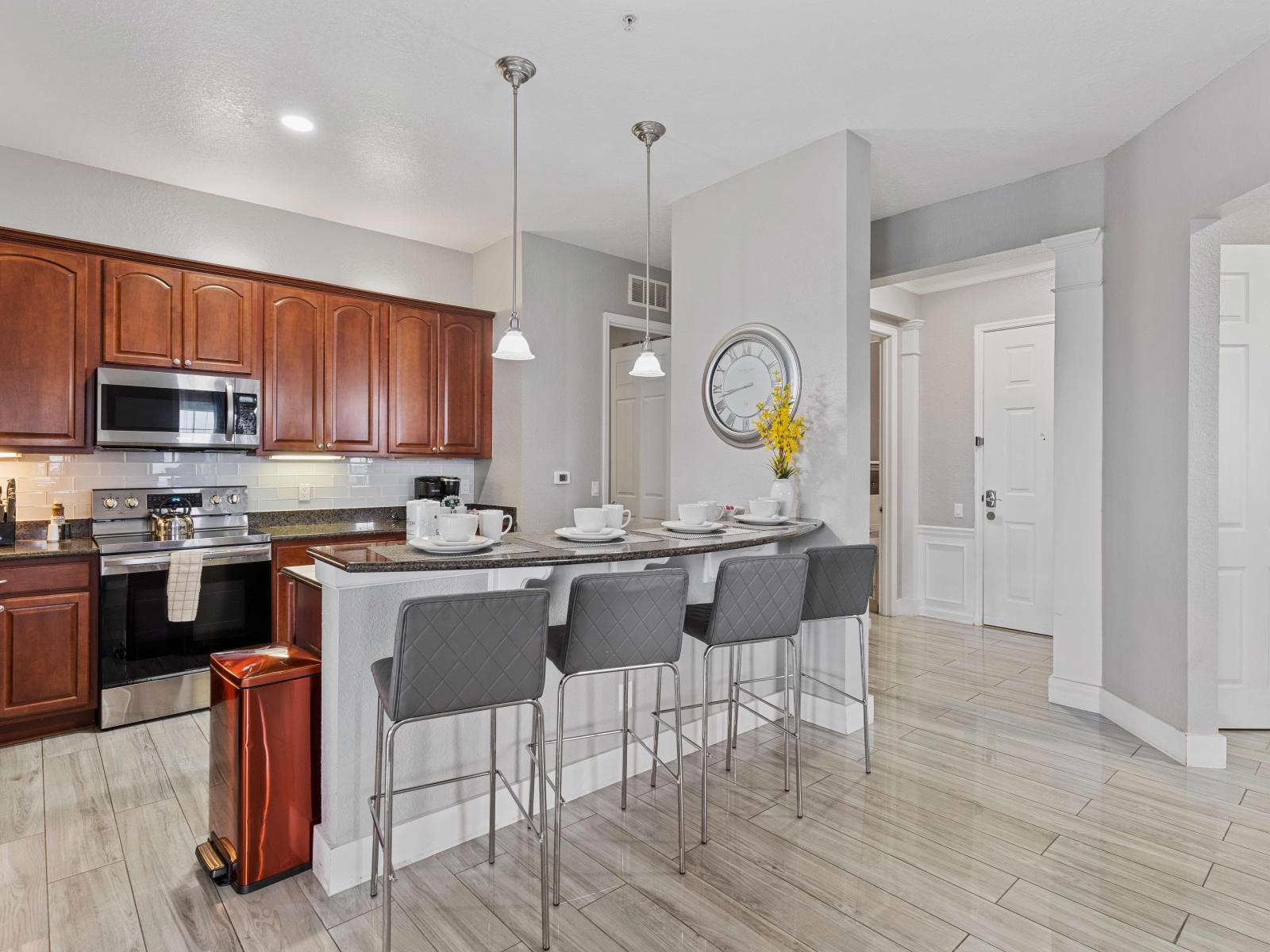 Discover the heart of the home in our fully equipped kitchen, complete with a convenient breakfast bar. Whether whipping up a quick snack or preparing a gourmet meal, this space invites culinary creativity and comfortable dining.