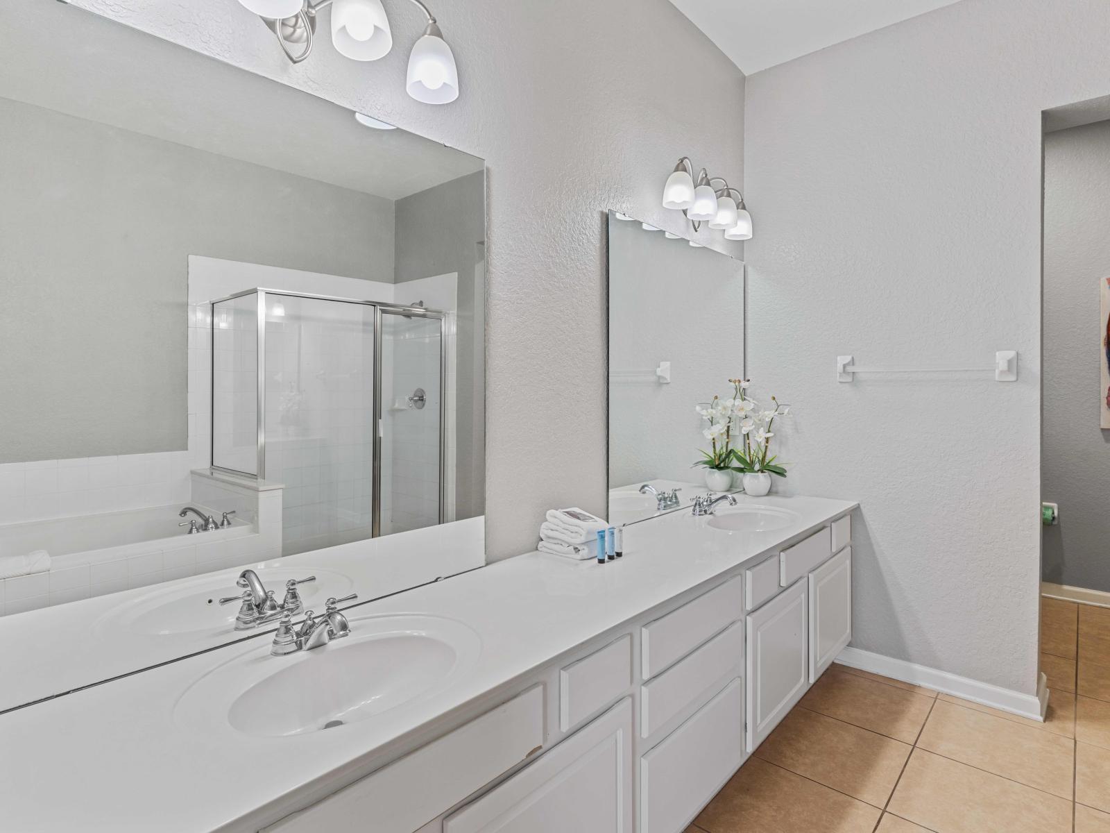 Step into Bathroom 1, where luxury meets functionality. Featuring a double vanity, large soaking tub, and walk-in shower, this lavish space offers a serene retreat for indulgent relaxation.