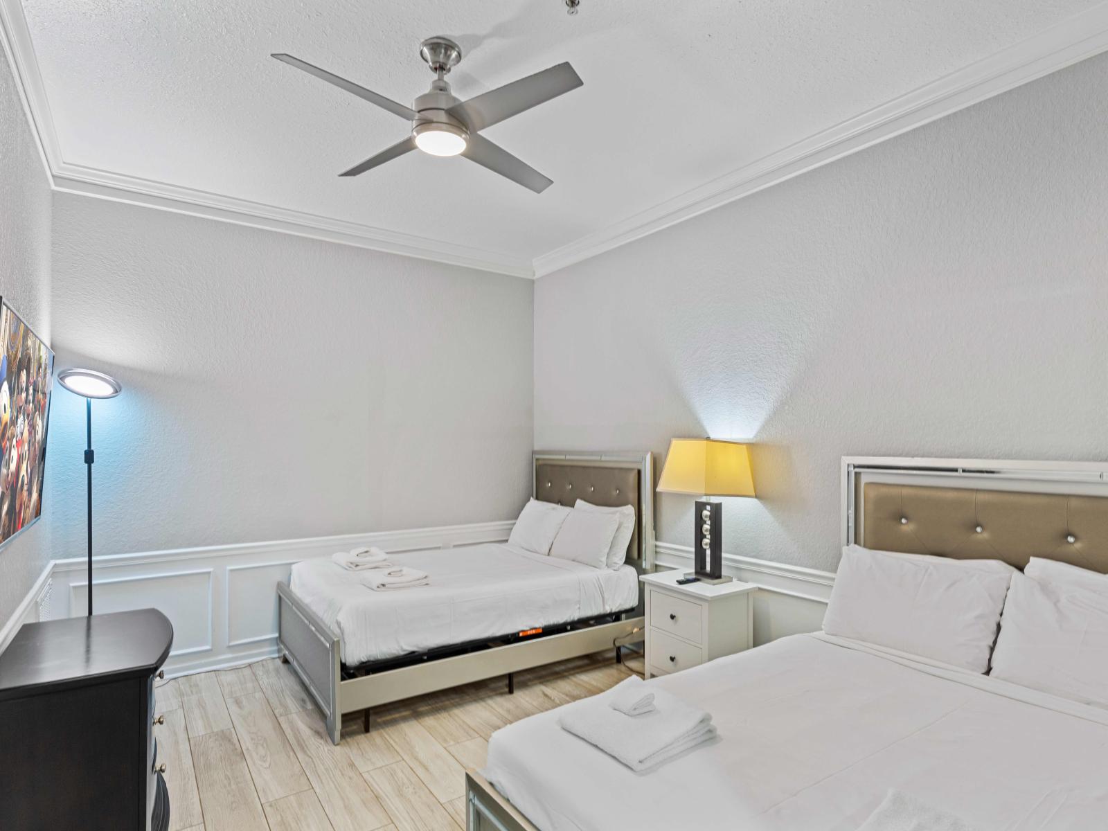 Double Comfort: Unwind in Bedroom 4, Offering Two Queen Size Beds for Plentiful Rest and Relaxation.