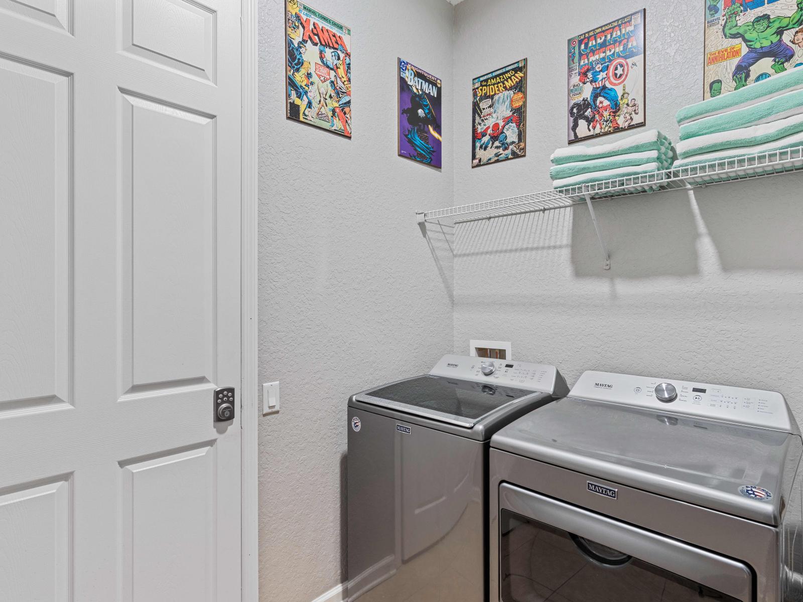 The laundry area boasts a full-size washer and dryer, ensuring that you can easily keep your clothes fresh and clean throughout your stay.