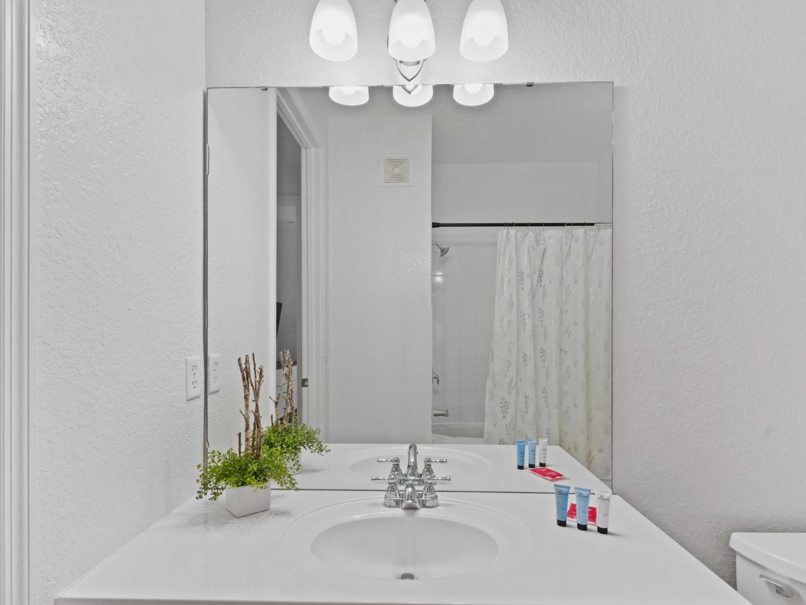 Enjoy the convenience of a tub/shower combination in this well-appointed space, perfect for a refreshing soak or a quick rinse.