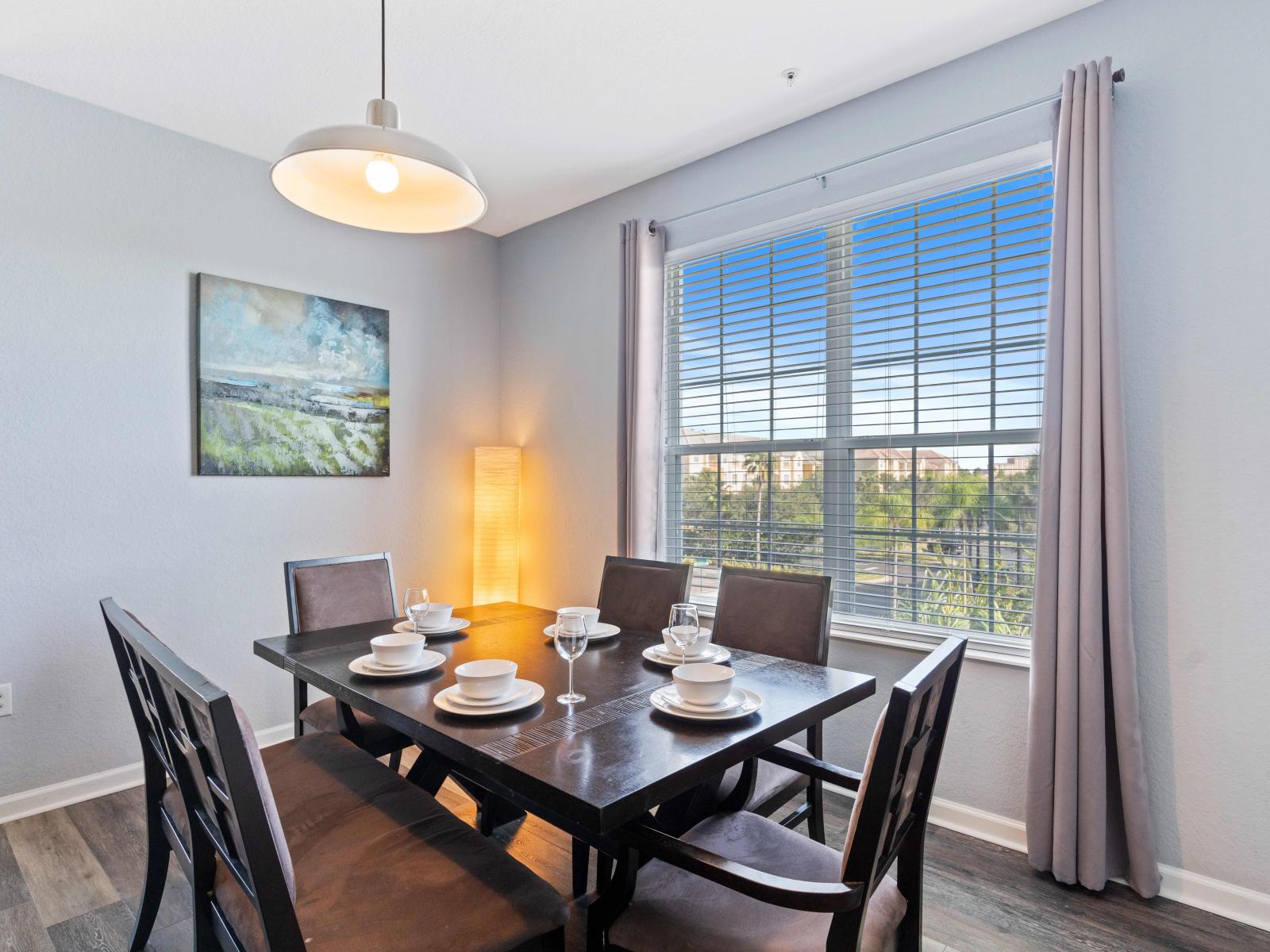 Dining area- Enjoy the delectable cuisine and the joy of companionship in this inviting setting.