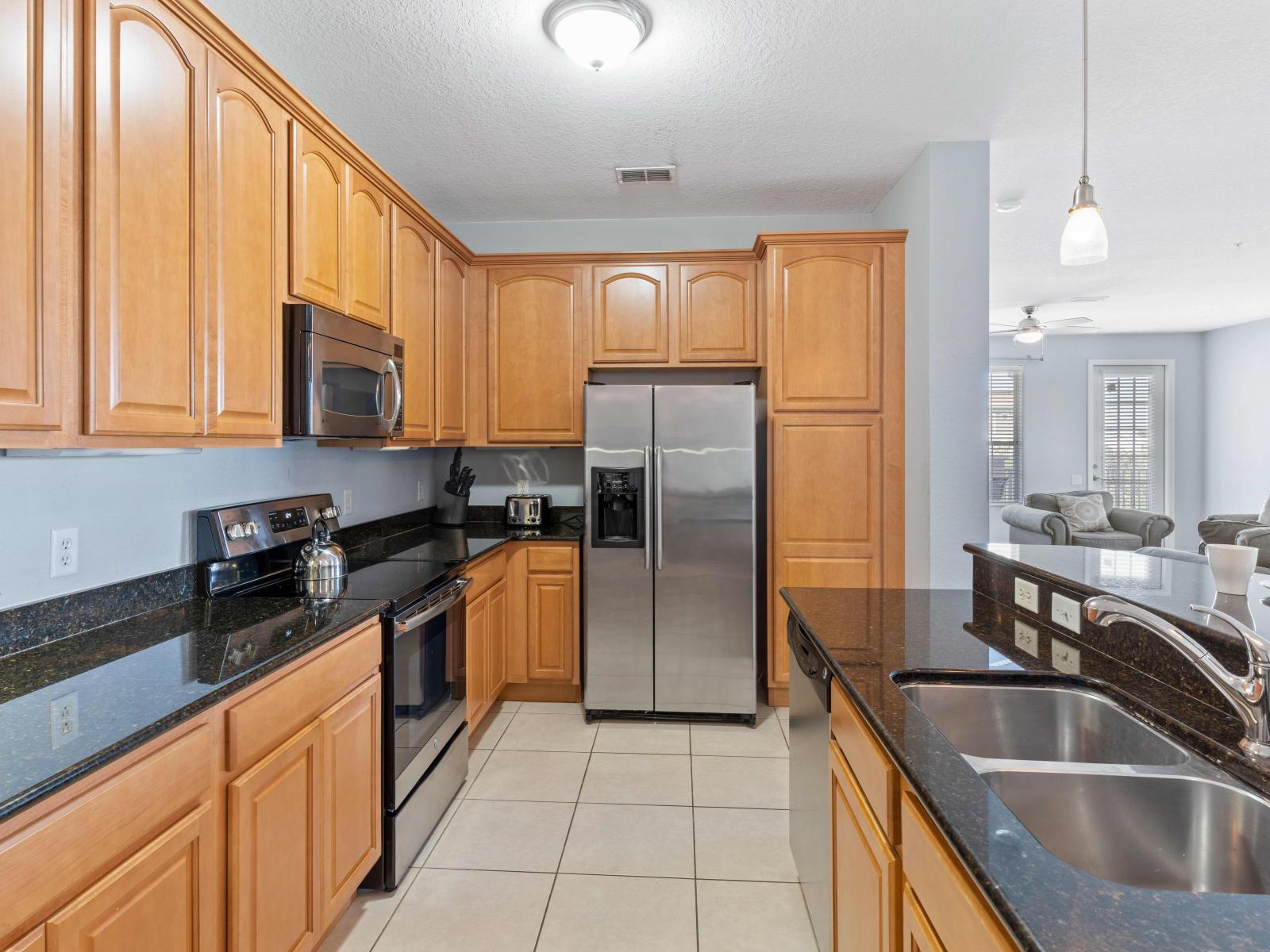 Boasting modern appliances, ample counter space, and a comprehensive array of cookware and utensils, this kitchen invites you to unleash your inner chef.