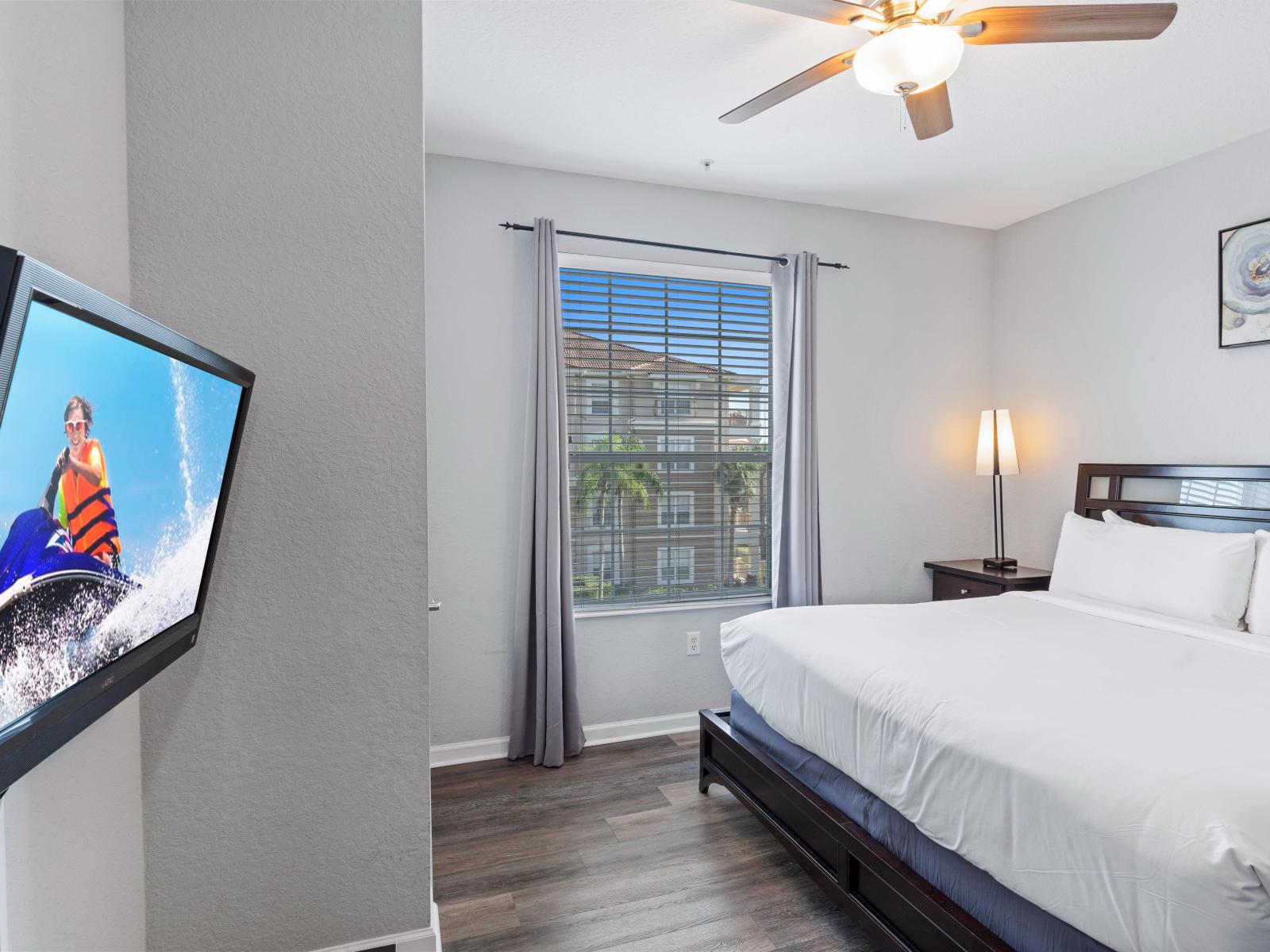 Welcome to Bedroom 1, your luxurious retreat! Featuring a spacious king-size bed and a TV, this bedroom offers the perfect blend of comfort and entertainment.