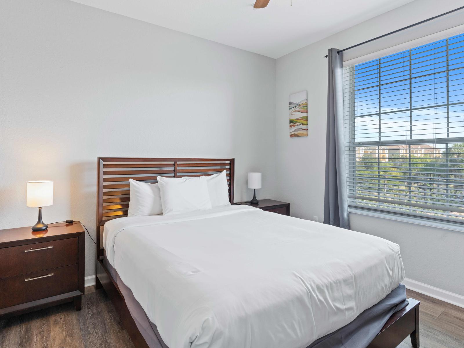 This room has a comfortable queen-size bed and a TV, this bedroom is designed for relaxation and convenience.