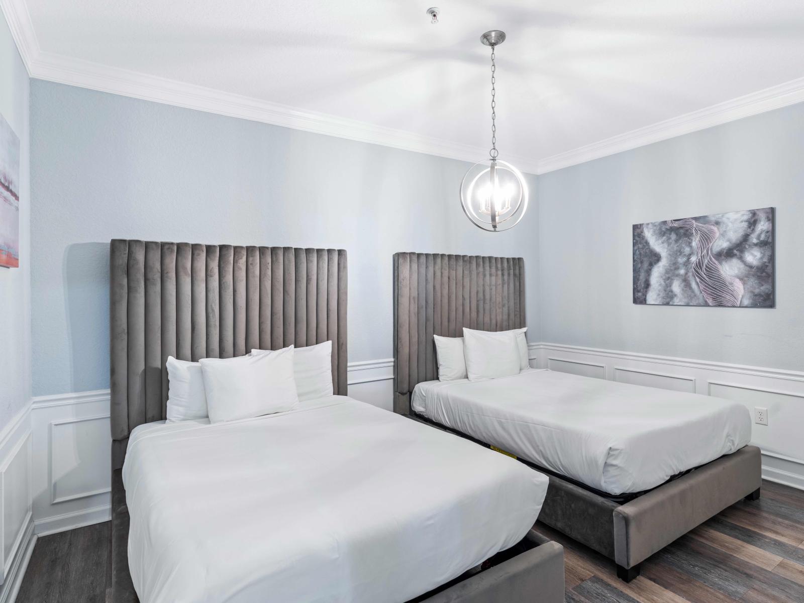 Enjoy spacious comfort in our bedroom featuring two cozy double beds.