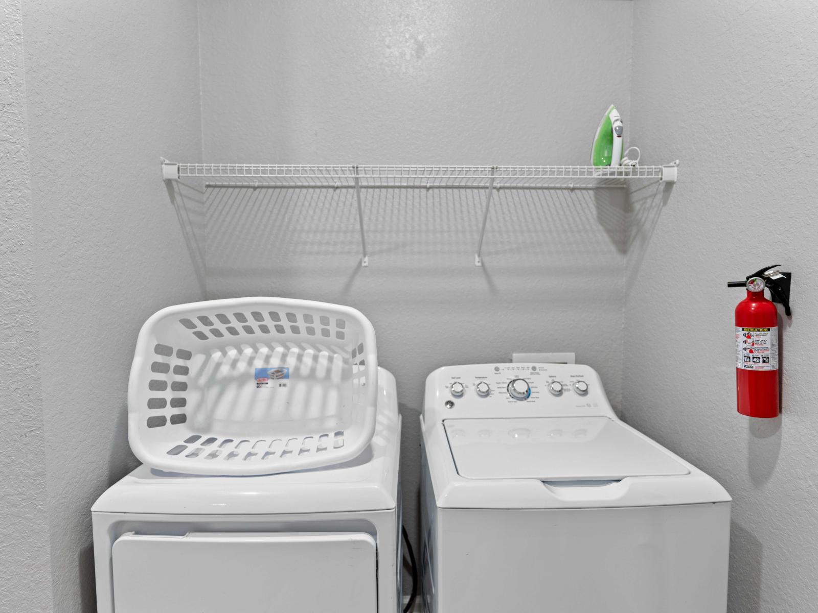 Convenient laundry room equipped with a full-size washer and dryer, ensuring your clothes are clean and ready throughout your stay.