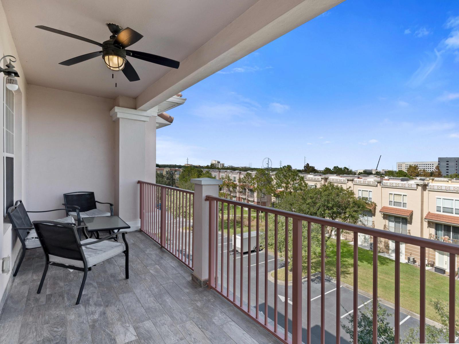 Enjoy the expansive balcony with a stunning view of the Orlando Wheel, offering ample space to relax and take in the cityscape.