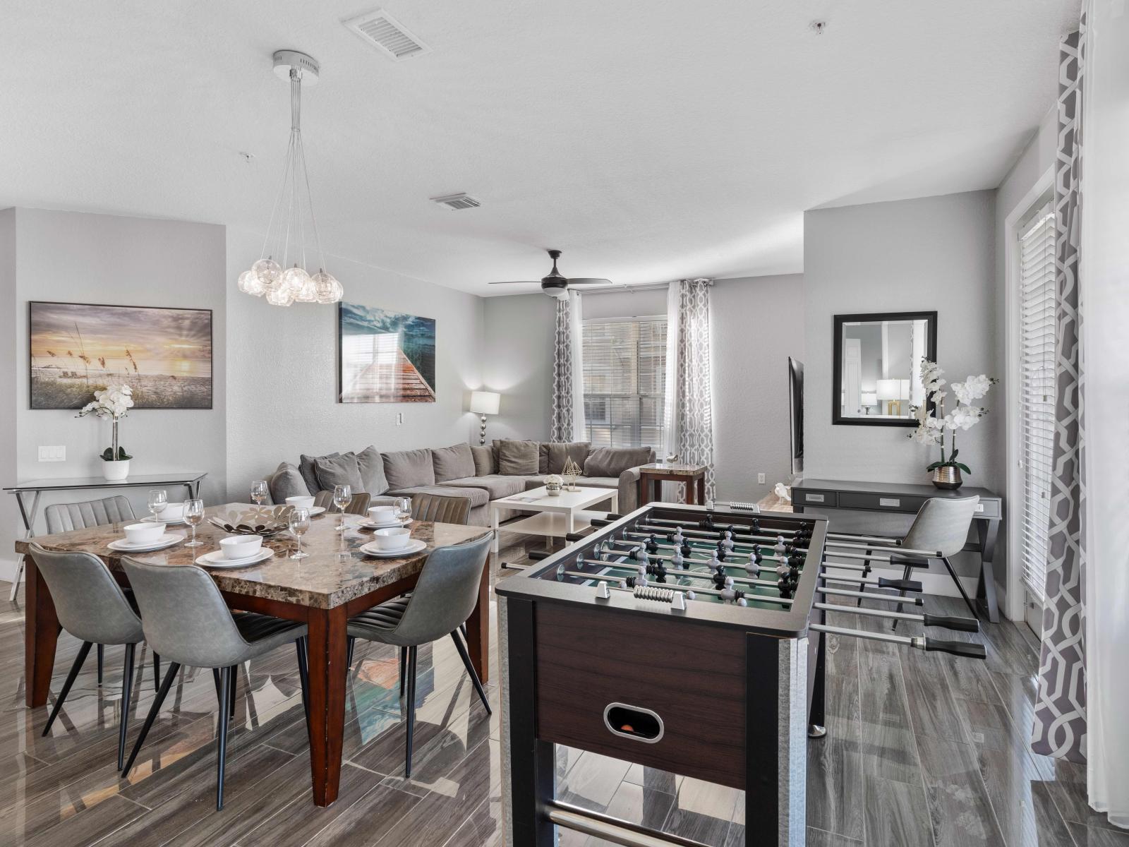 Experience the ultimate blend of relaxation and entertainment in the living room, complete with a thrilling foosball table.