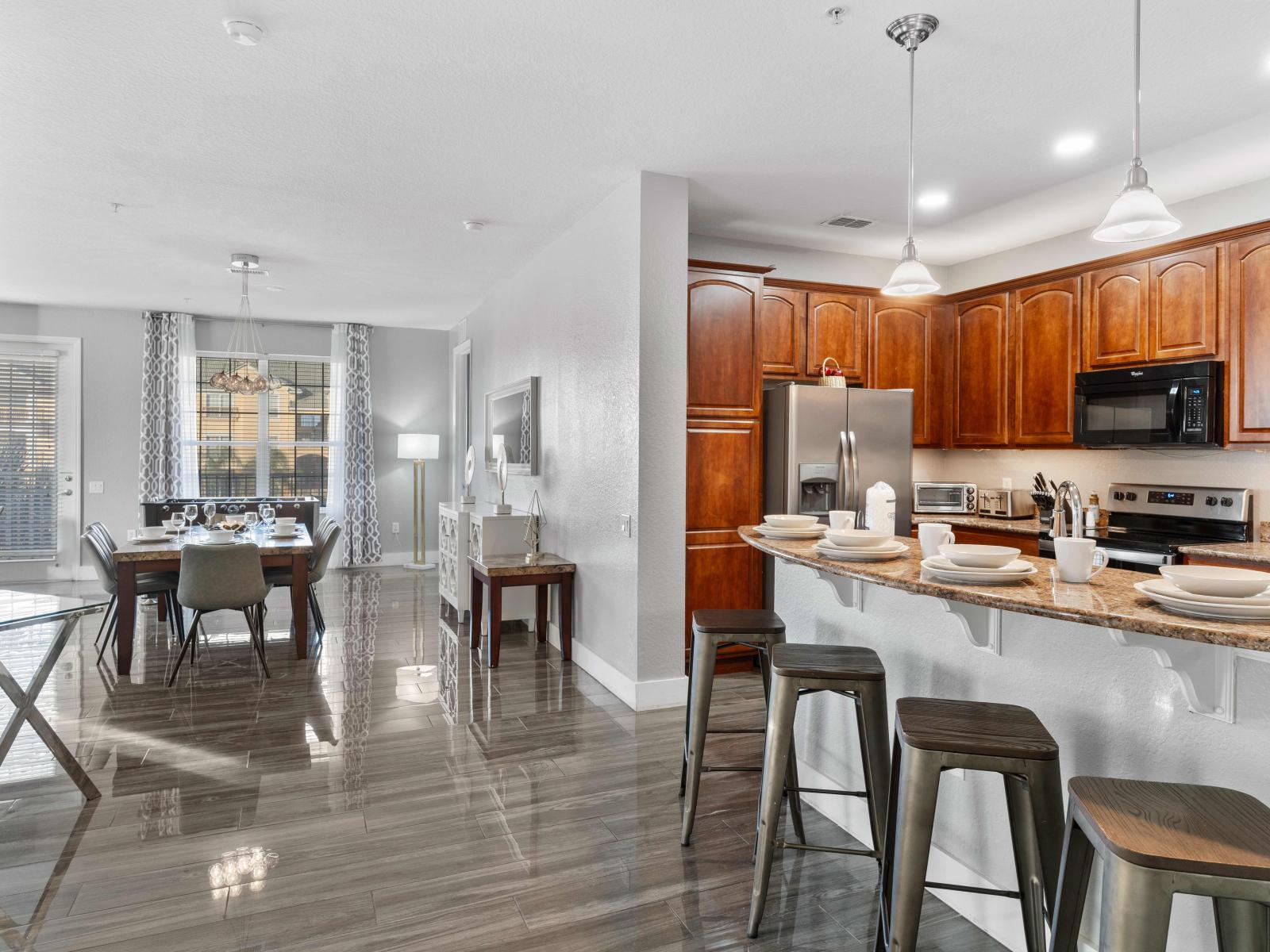 Fully equipped kitchen with breakfast bar- a gourmet haven where cooking becomes a delight.