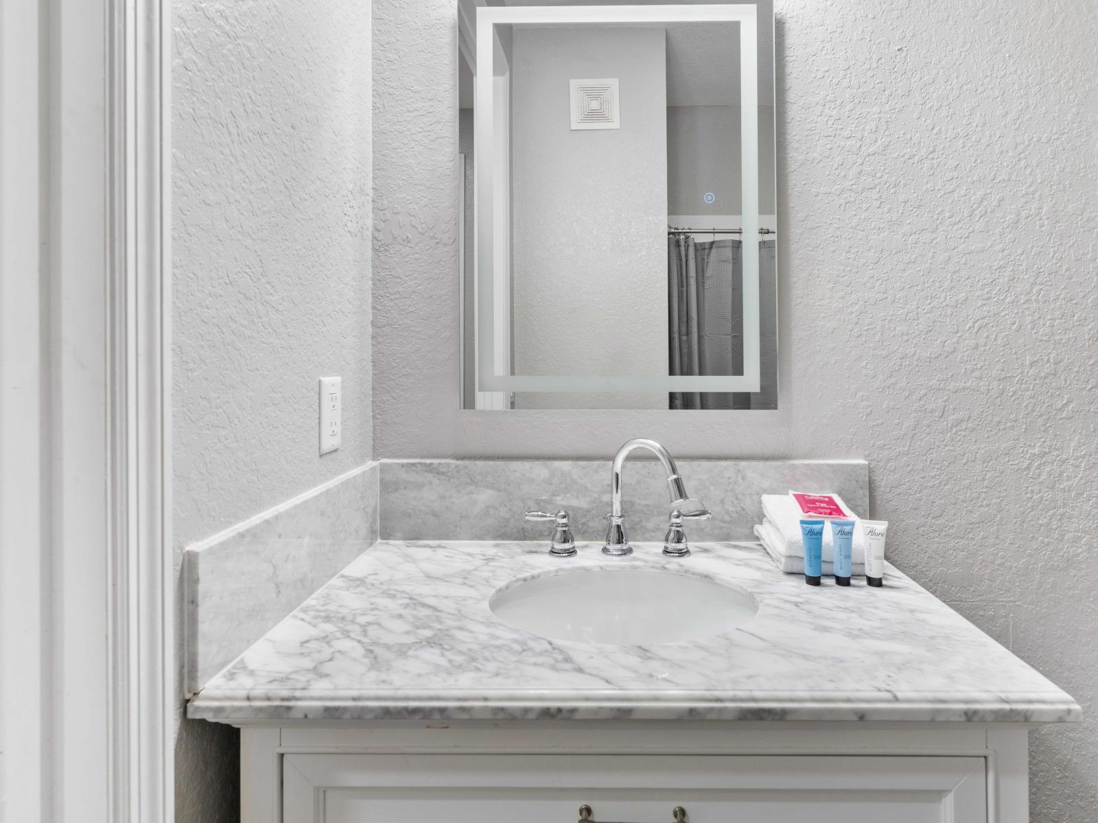 Bathroom 2 with tub/shower combination-the perfect retreat for relaxation and rejuvenation during your stay.