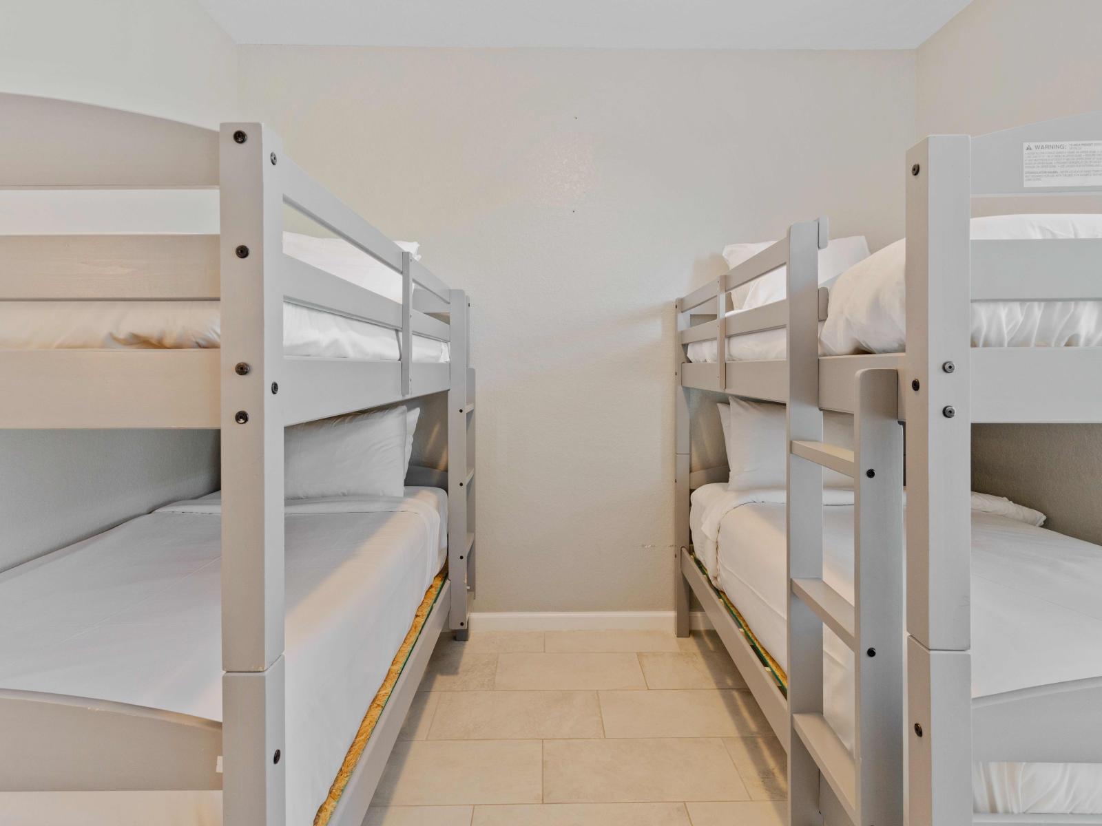 Bedroom 3 is a cozy retreat featuring two single-size bunk beds, perfect for young adventurers.