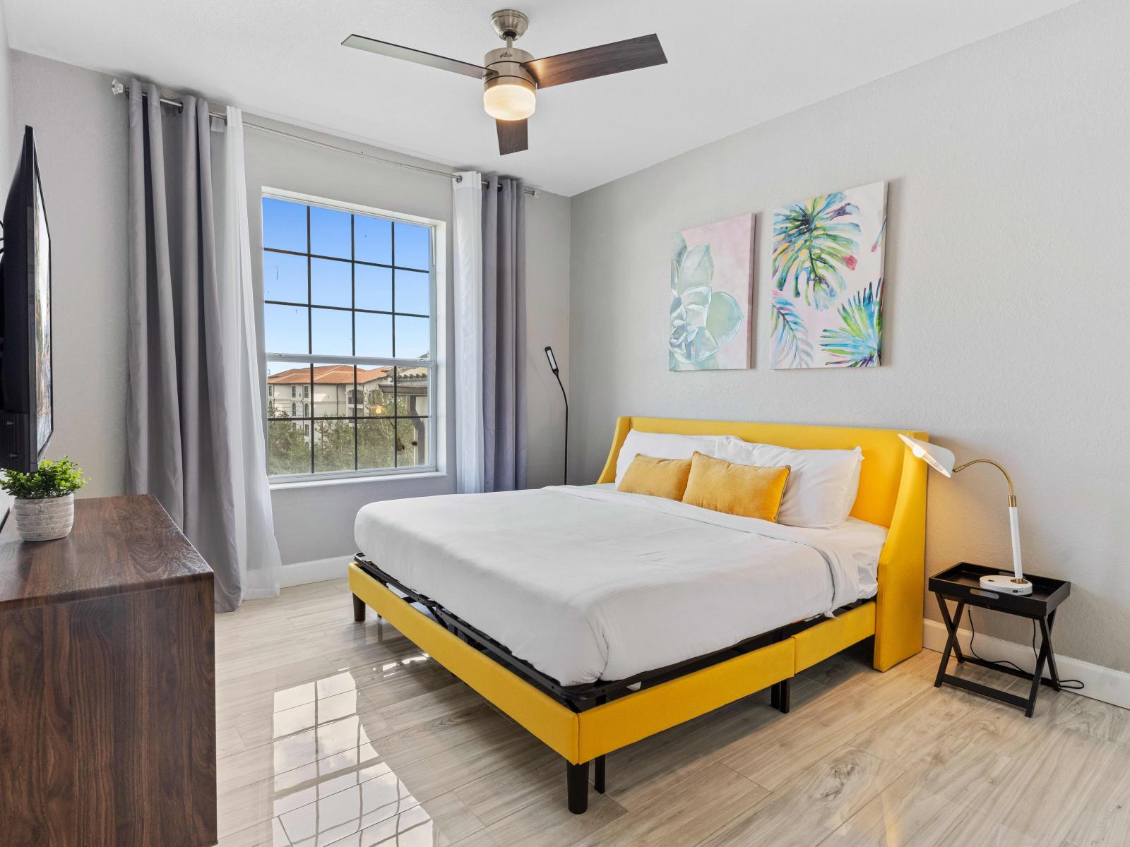 Chic bedroom of the condo in Orlando Florida - Cozy double bed with plenty of natural light, creating a bright and airy ambiance. - A perfect blend of contemporary design - Plush bedding, and an ambiance that exudes exclusivity