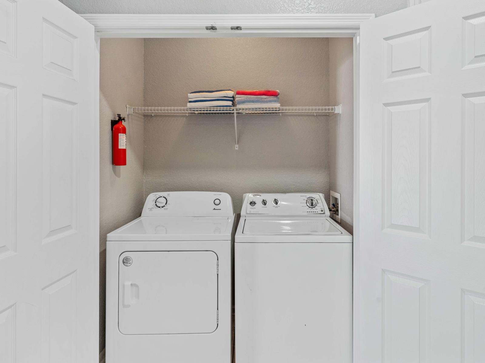 Laundry area with full washer and dryer - Laundry area is fully-equipped with modern appliances for hassle-free laundry - User-friendly laundry area of the condo in Orlando Florida