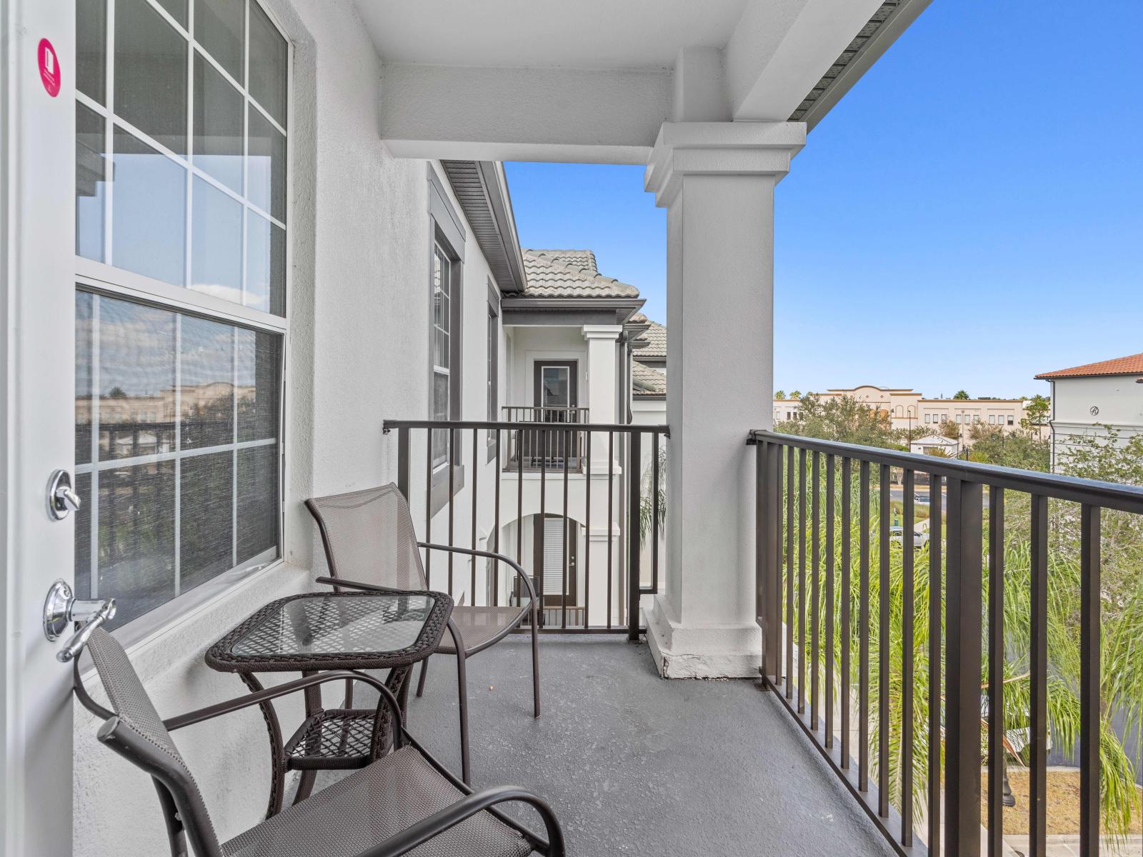 Aerial Retreat private balcony of the condo in Orlando Florida - Panoramic stunning view visible from the balcony - Relaxing seating on the balcony, providing  comfortable spaces to unwind