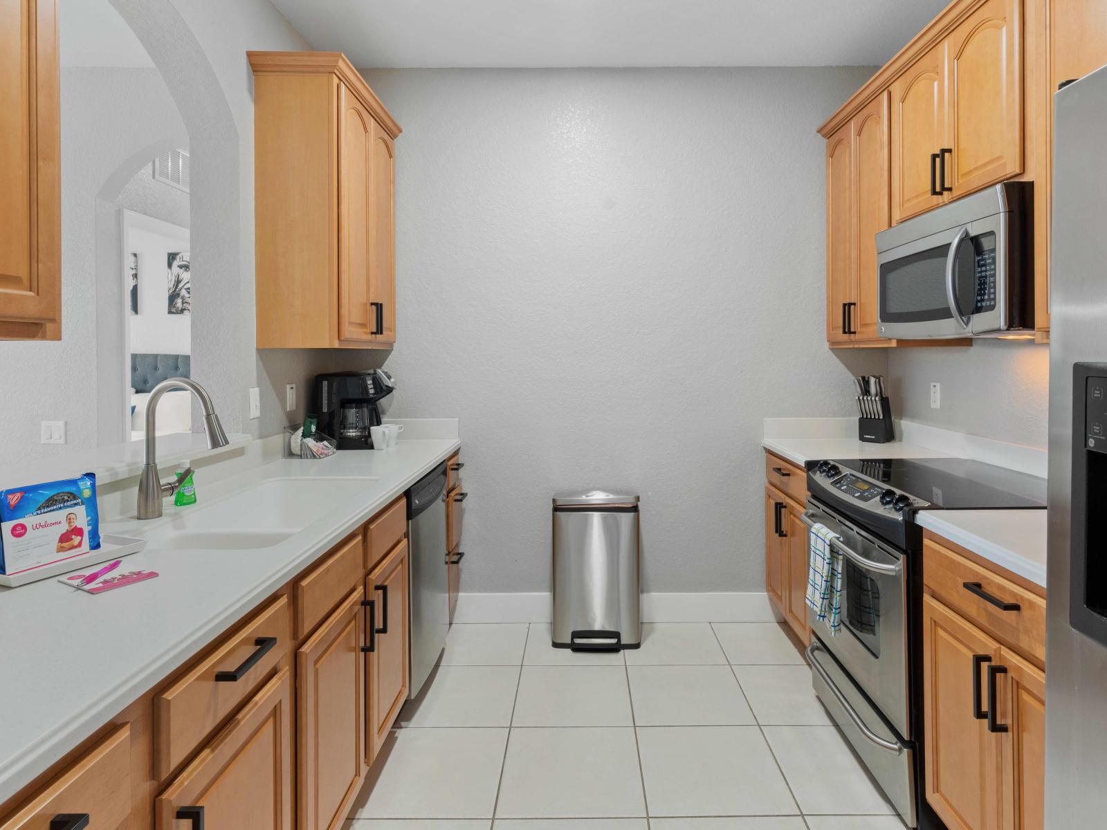 Cooking in Style: Our condo's kitchen is a chef's dream, fully furnished with contemporary flair, creating a space where cooking becomes a stylish affair