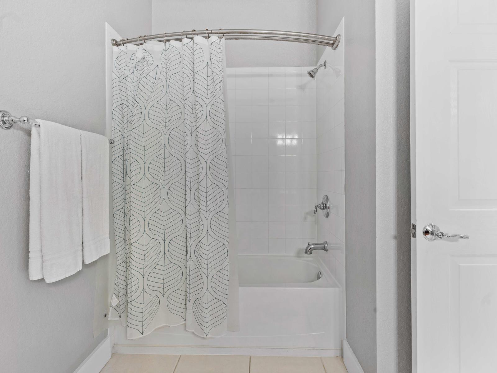 Find comfort and convenience in Bathroom 2, featuring a versatile tub/shower combination, providing the perfect blend of relaxation and functionality for your daily routines.