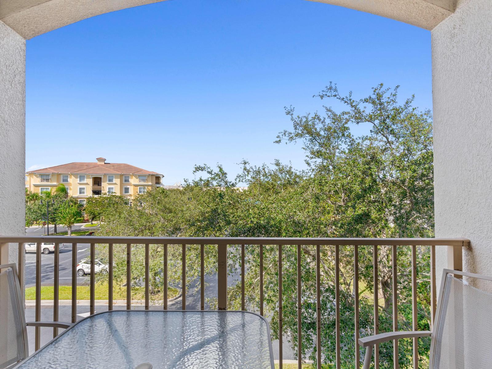 A serene balcony adorned with cozy chairs, beckoning for moments of relaxation and contemplation.