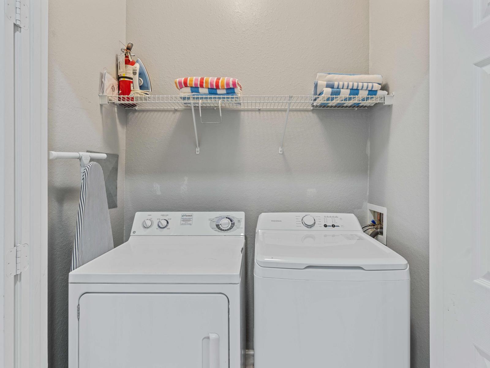 Conveniently located within the apartment, the laundry area boasts a full-size washer and dryer, ensuring that you can easily keep your clothes fresh and clean throughout your stay.