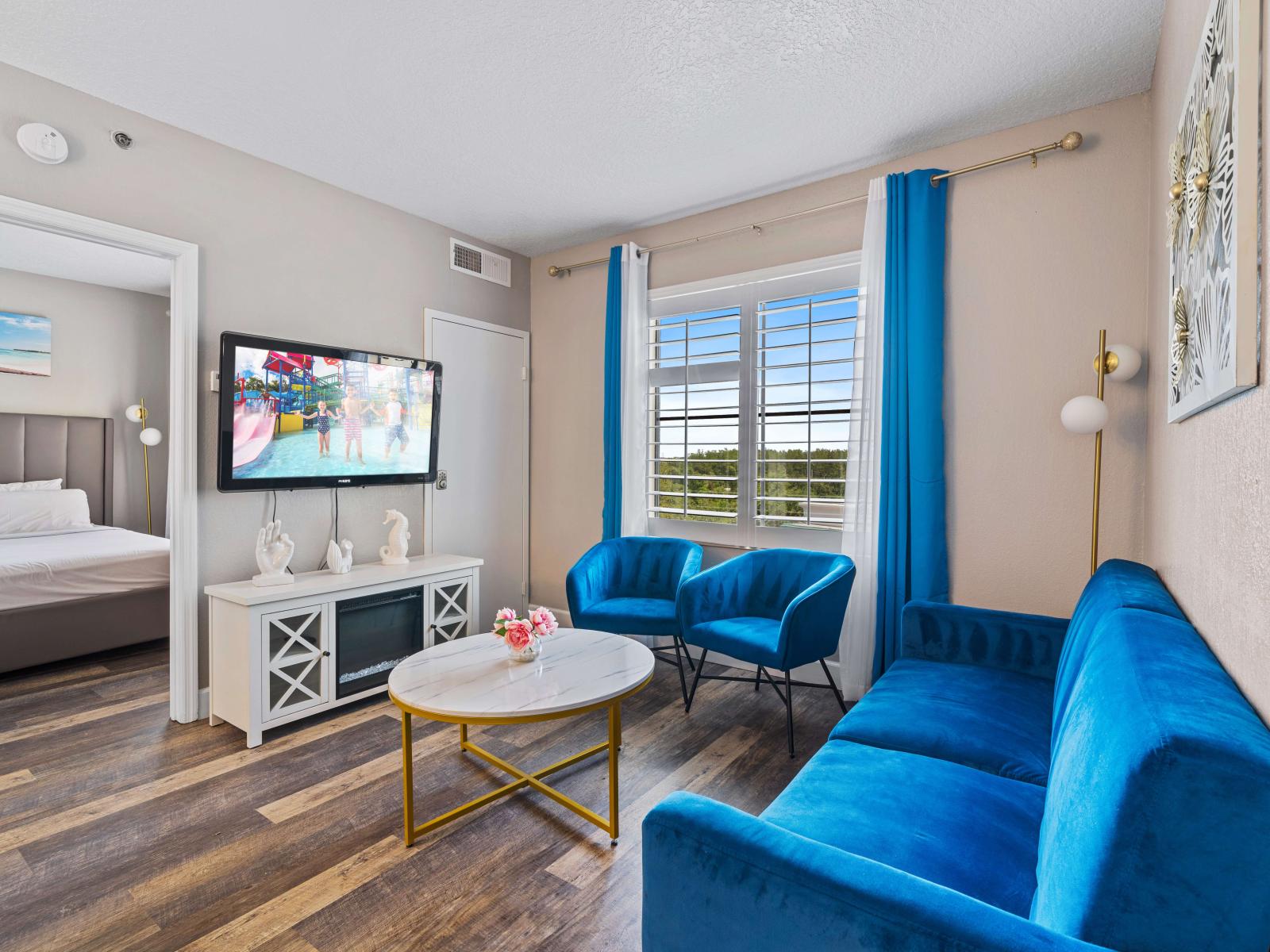 Lovely living area of the condo in Orlando Florida - Beautiful living room with an open layout, creating a sense of spaciousness - Smart TV and plush sofas - Elegantly decored