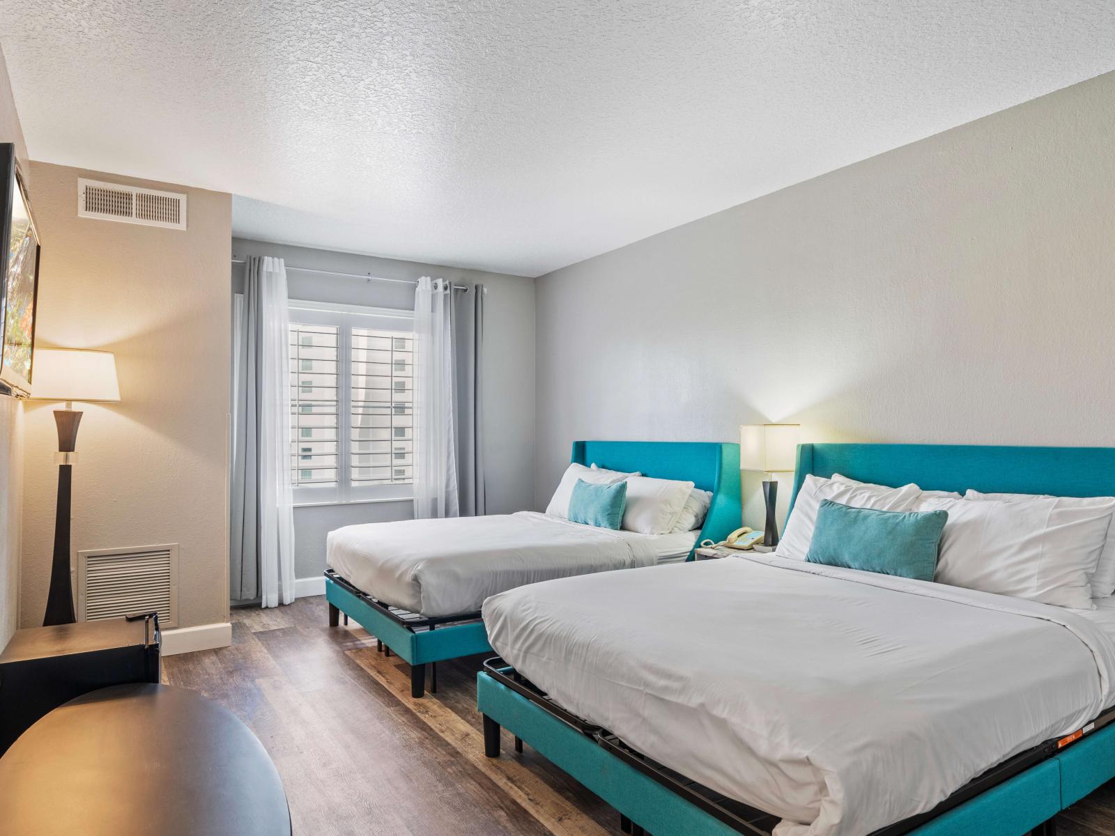 Elegant bedroom of the condo in Orlando Florida - Cozy two double beds and a private bathroom - Smart TV for endless entertainment - Stunning views from the bedroom window