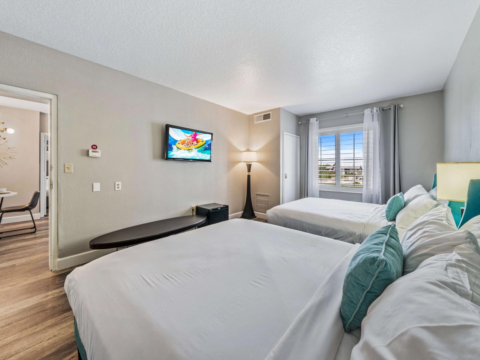 Comfy bedroom of the condo in Orlando Florida - Plush pillows and silky linens for ultimate comfort - A soothing color palette for relaxation and rejuvenation - Two plush and comfy double bed