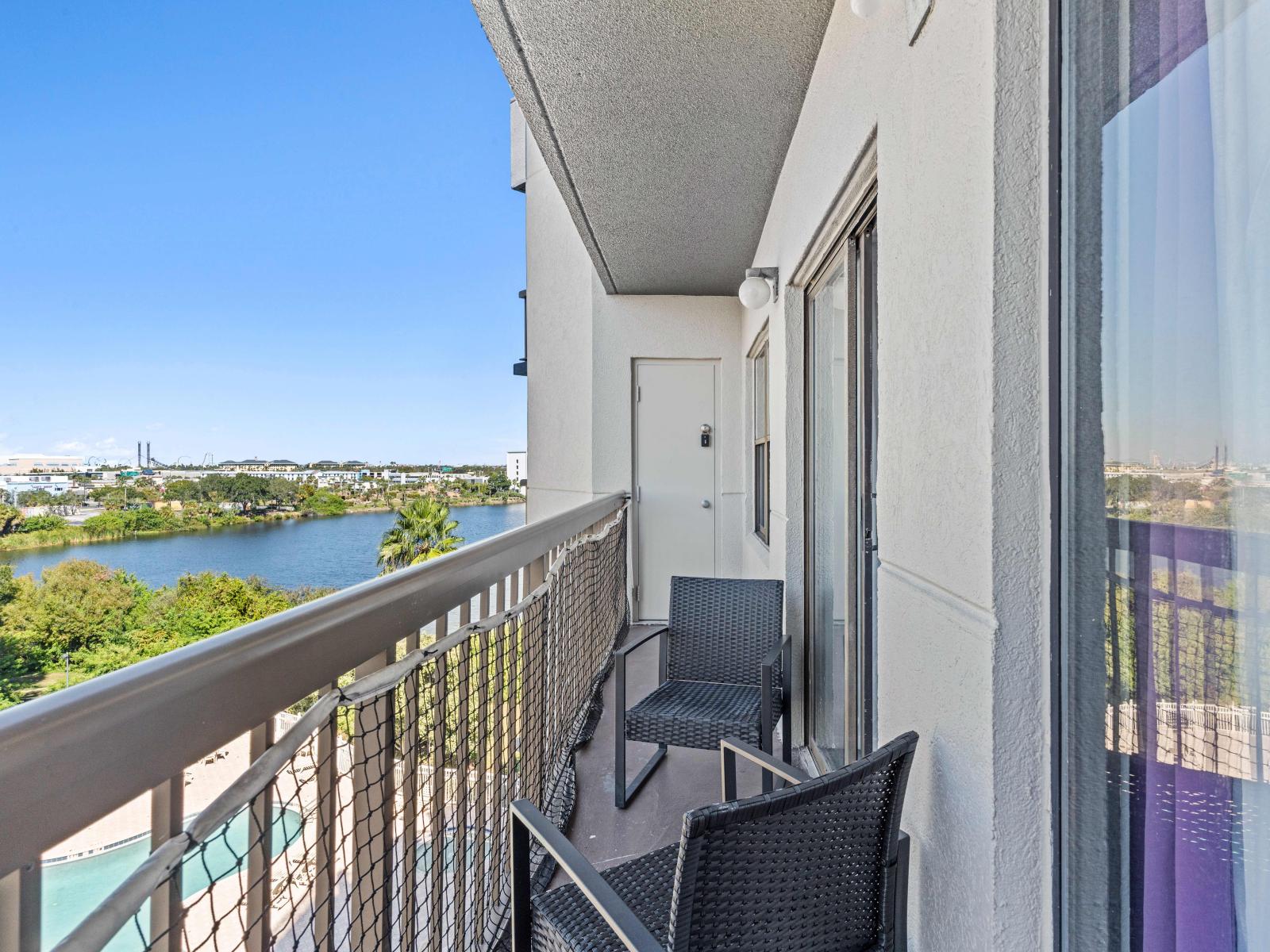 Balcony with pool and lake view