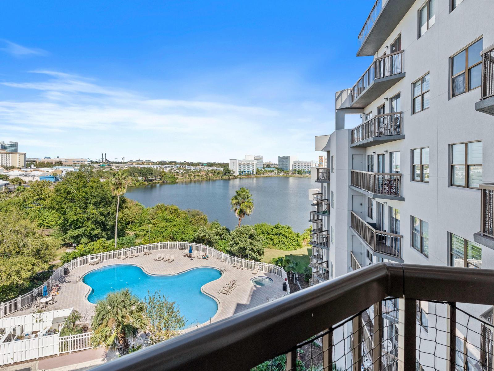 Balcony overlooking the pool and lake with great views of Universal from afar