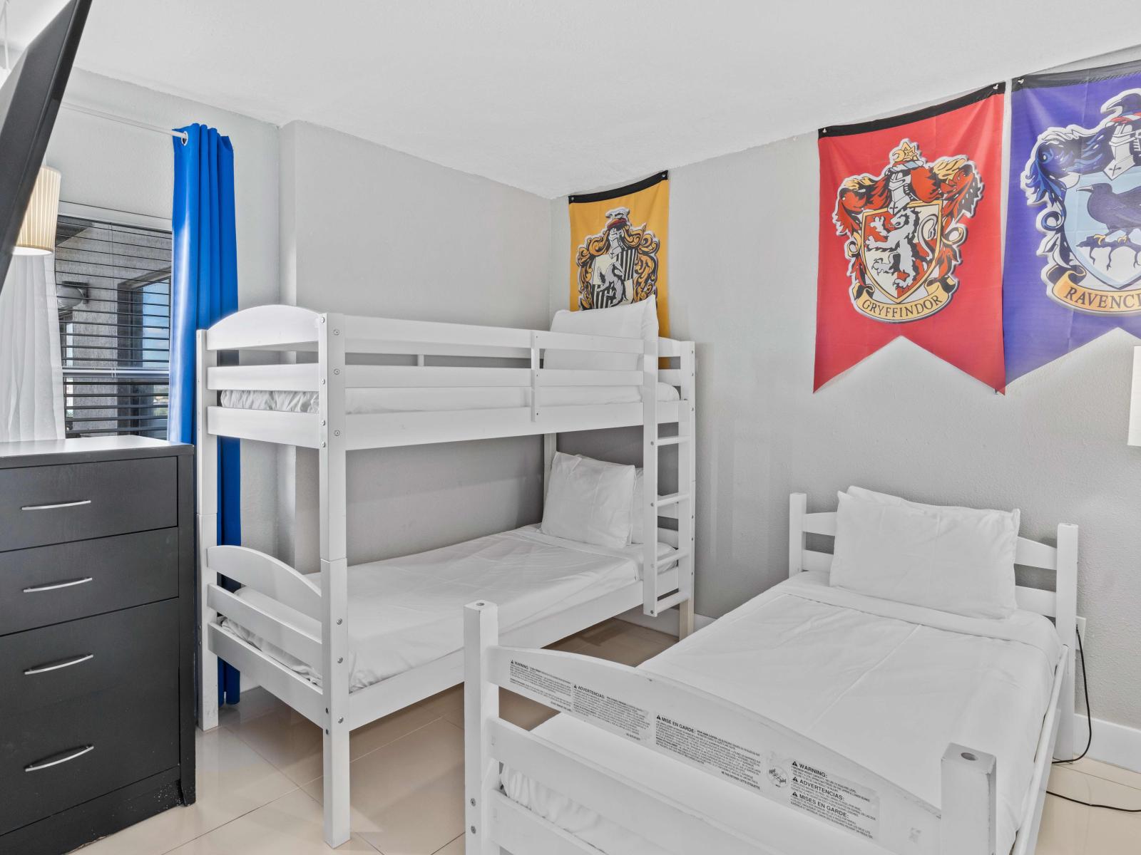 Harry Potter themed bedroom with one single size bunk bed and one additional single size bed (sleeps 3)