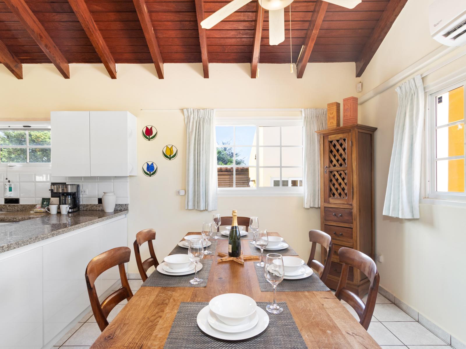 Dining Area of the home in Noord Aruba - 6 Persons Dining - Open-concept design facilitates seamless flow between living, dining, and kitchen - Beautifully crafted table