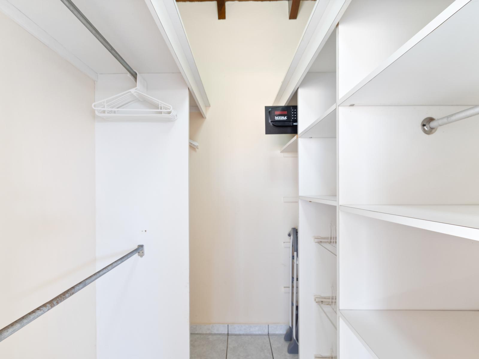 Neat Walk in Closet of the bedroom of home in Noord Aruba - Plenty of room for storage - Thoughtful storage solutions with shelves