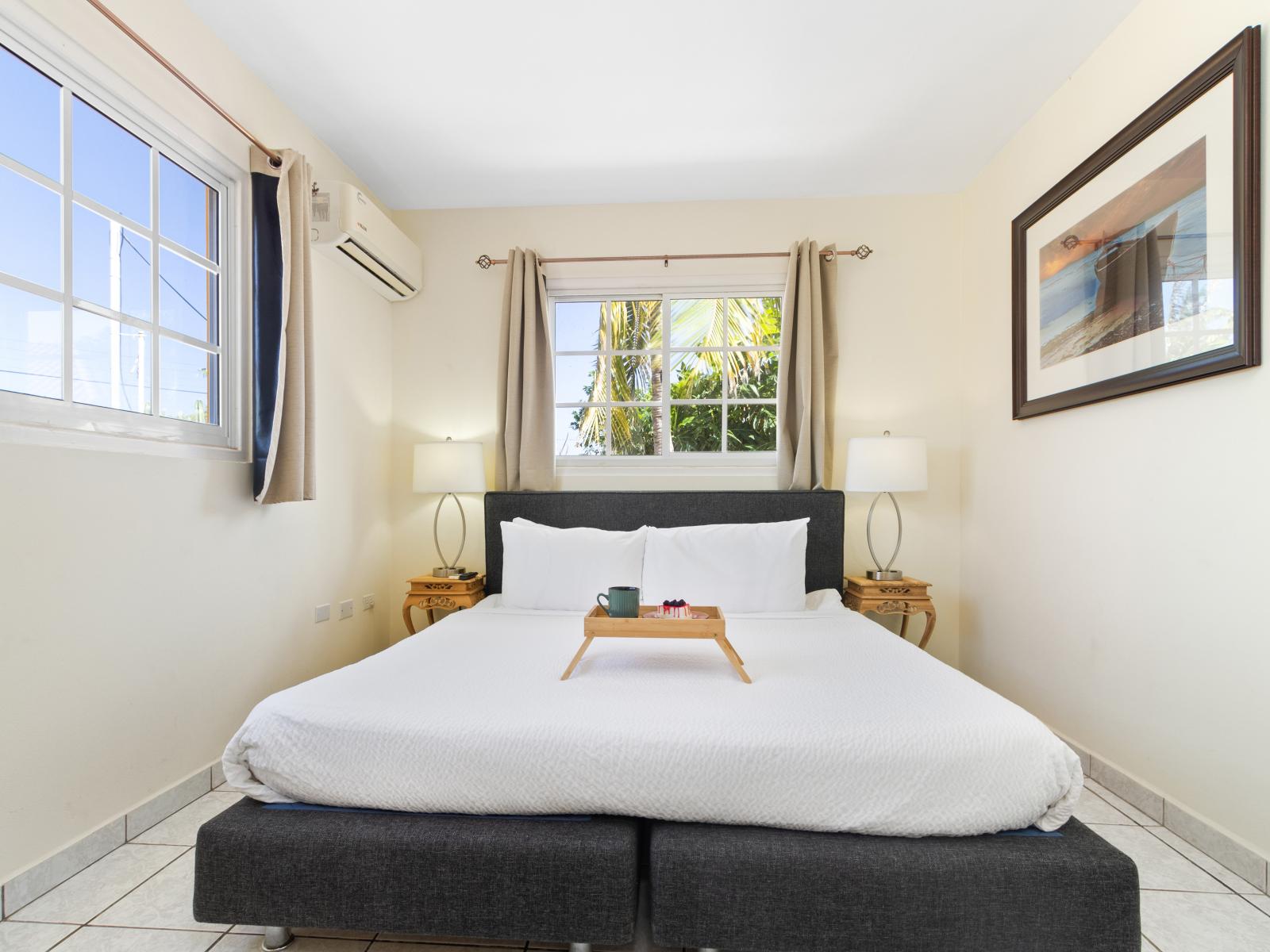 Experience comfort and privacy: the third bedroom features a queen bed and its own ensuite bathroom.