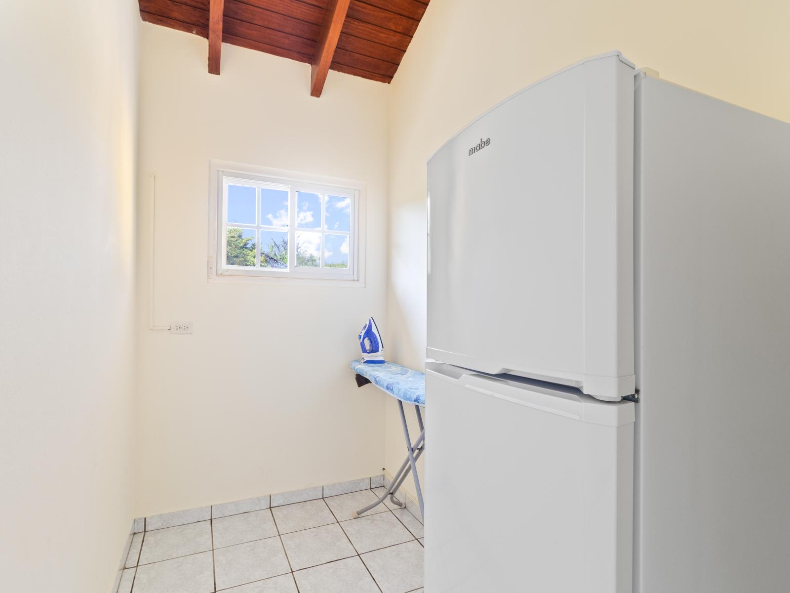 Experience the ease of our laundry room, complete with a washer and dryer for your convenience.