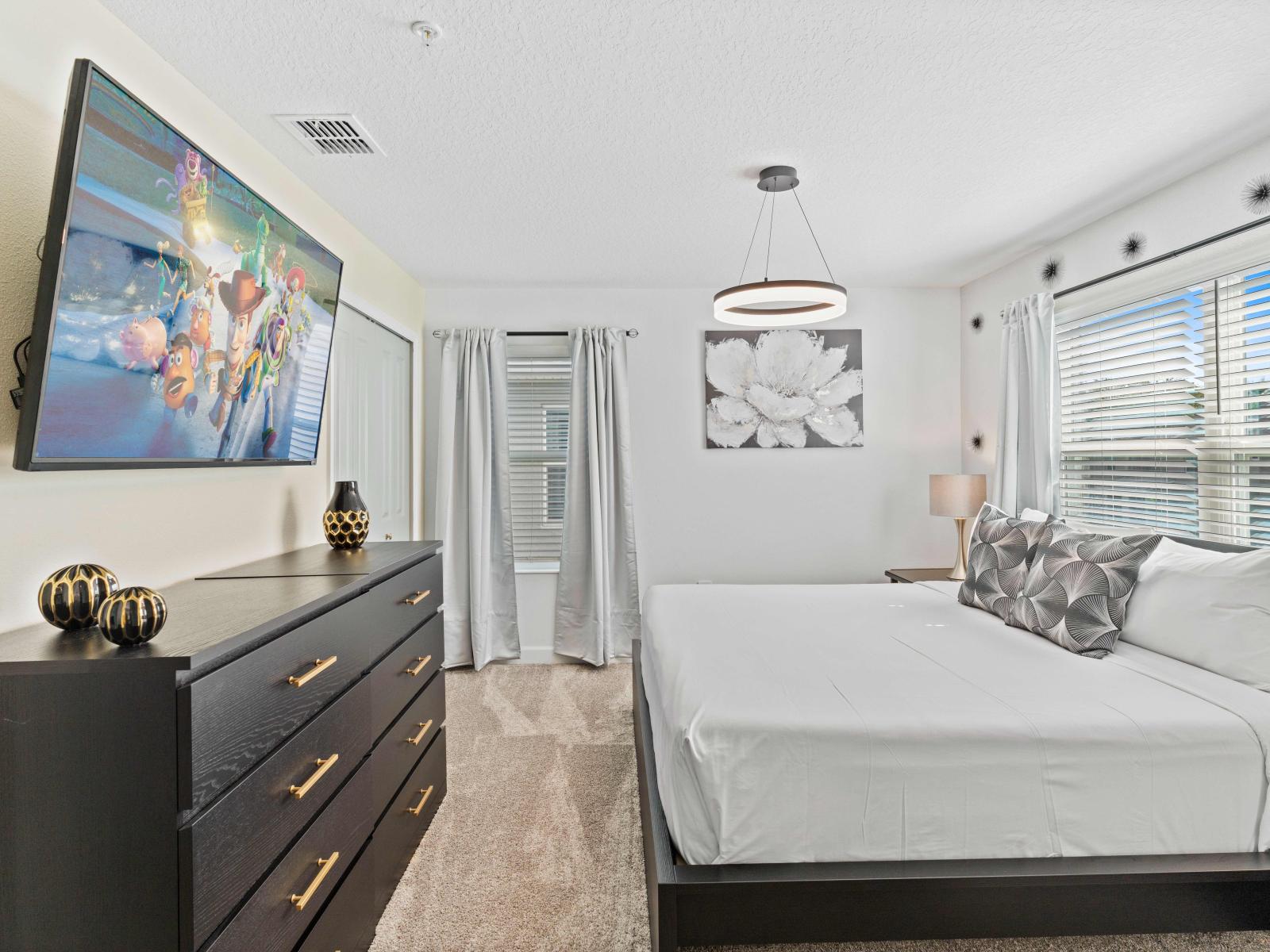 Indulge in Bedroom 5's spacious comfort, complete with a king-size bed and private bathroom for ultimate relaxation.