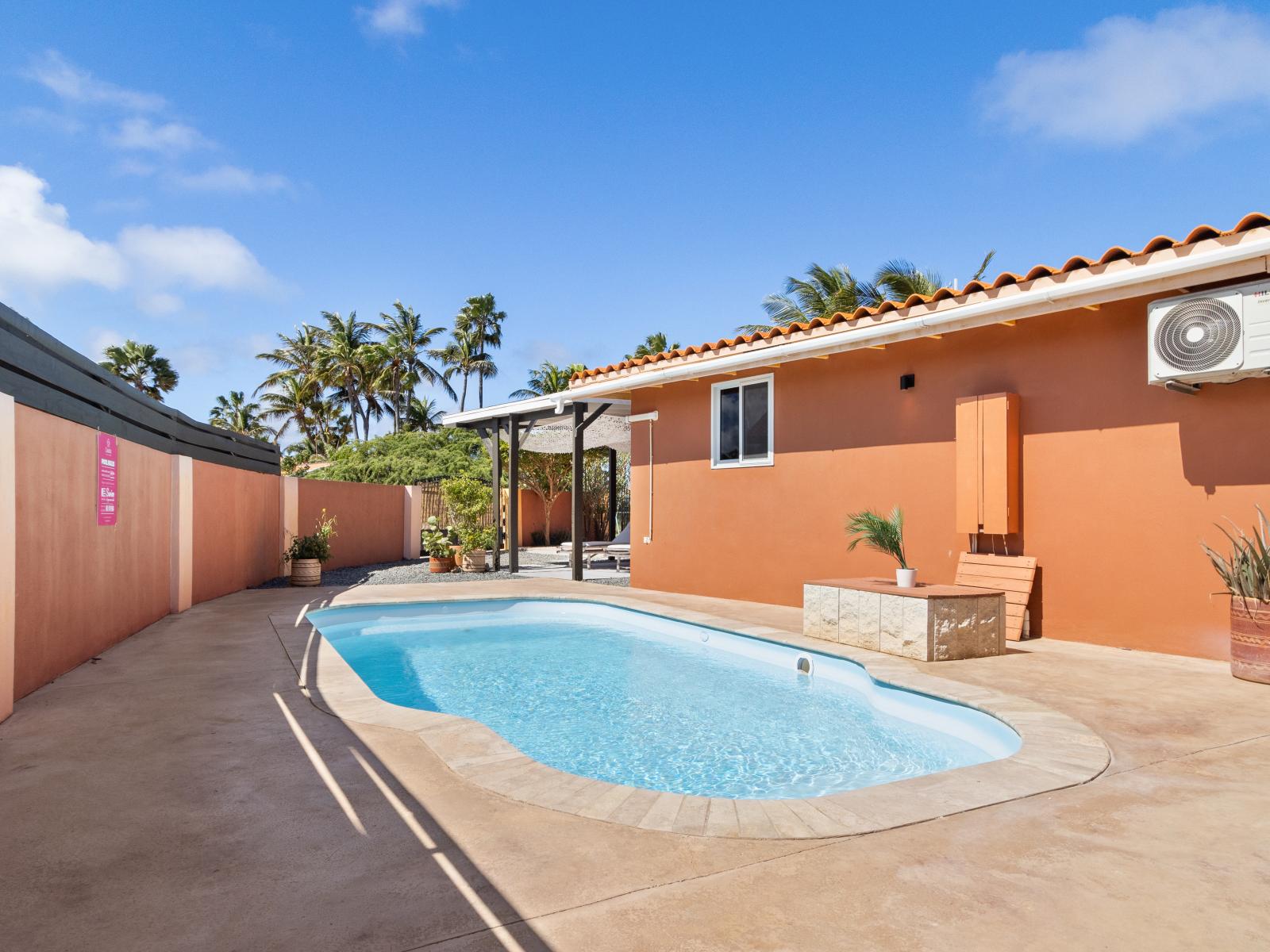 Luxury pool area of the 3BR House in Noord, Aruba - Lush and refreshing environment - Beautifully sunbathed space makes the soul peaceful  - Experience the comfort at the best